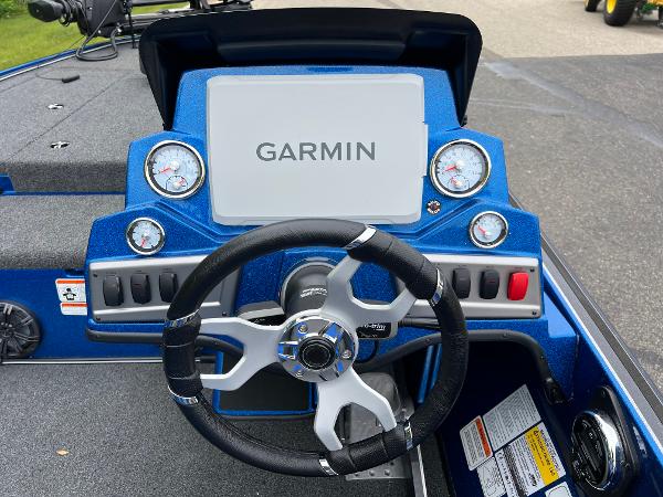 2025 Nitro Z19 Pro boat dashboard with Garmin display and steering wheel.