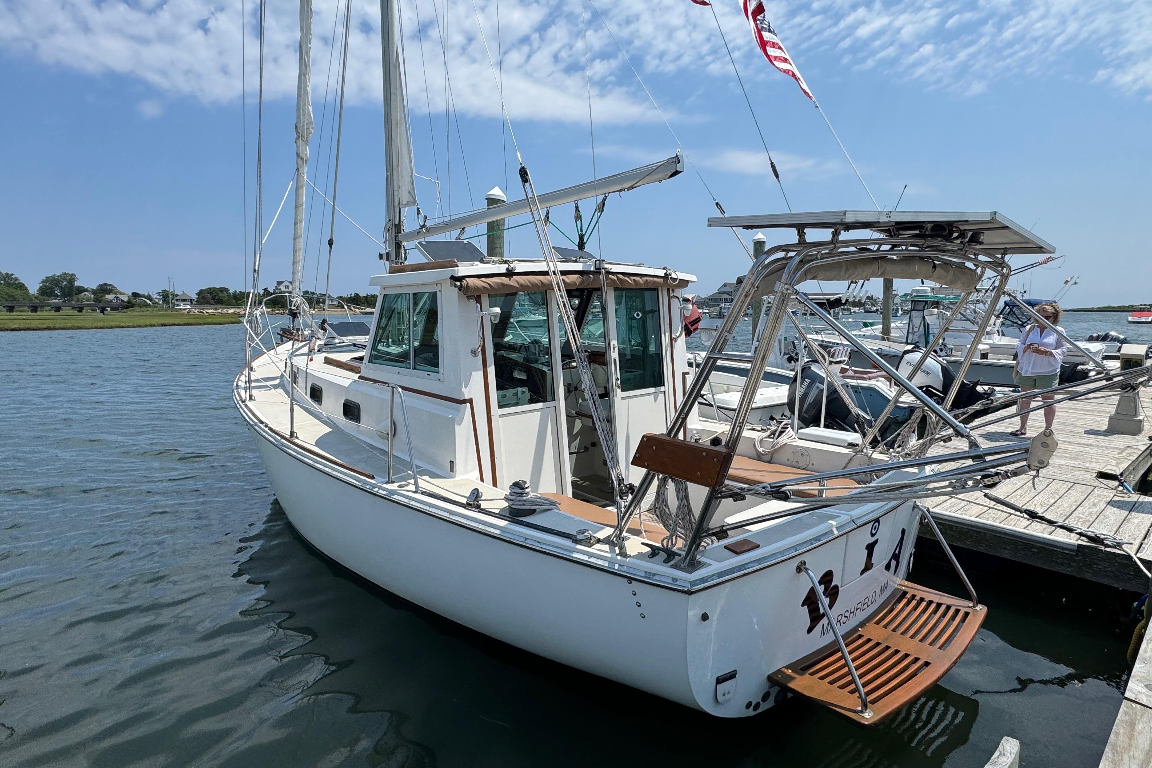 1989 Cape Dory 30 Motorsailer docked, showcasing its classic design and sturdy build.