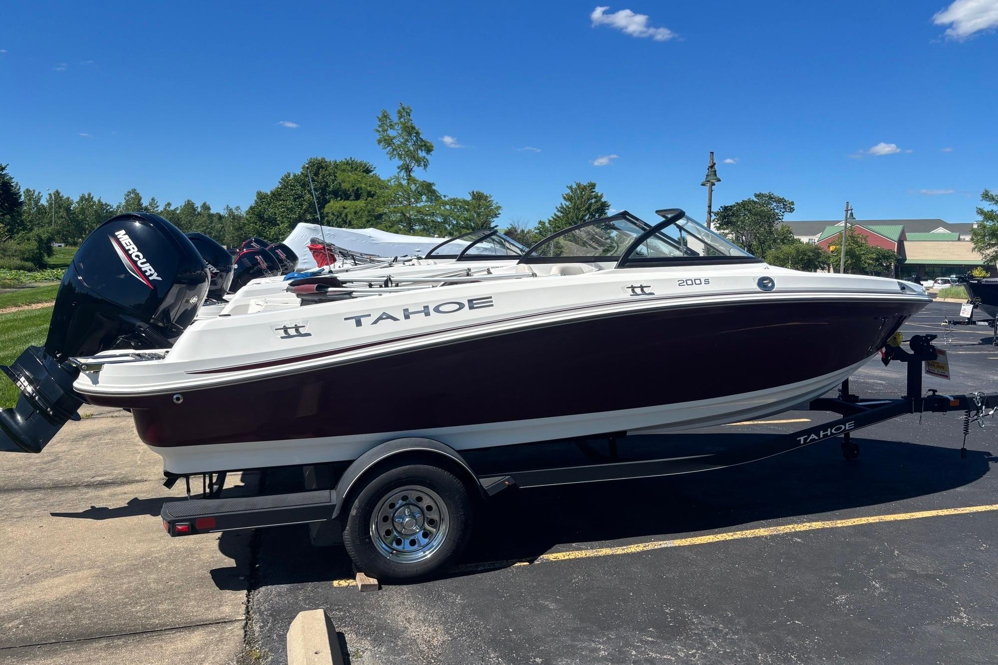 2024 Tahoe 200 S boat on trailer, featuring sleek design and Mercury outboard motor.