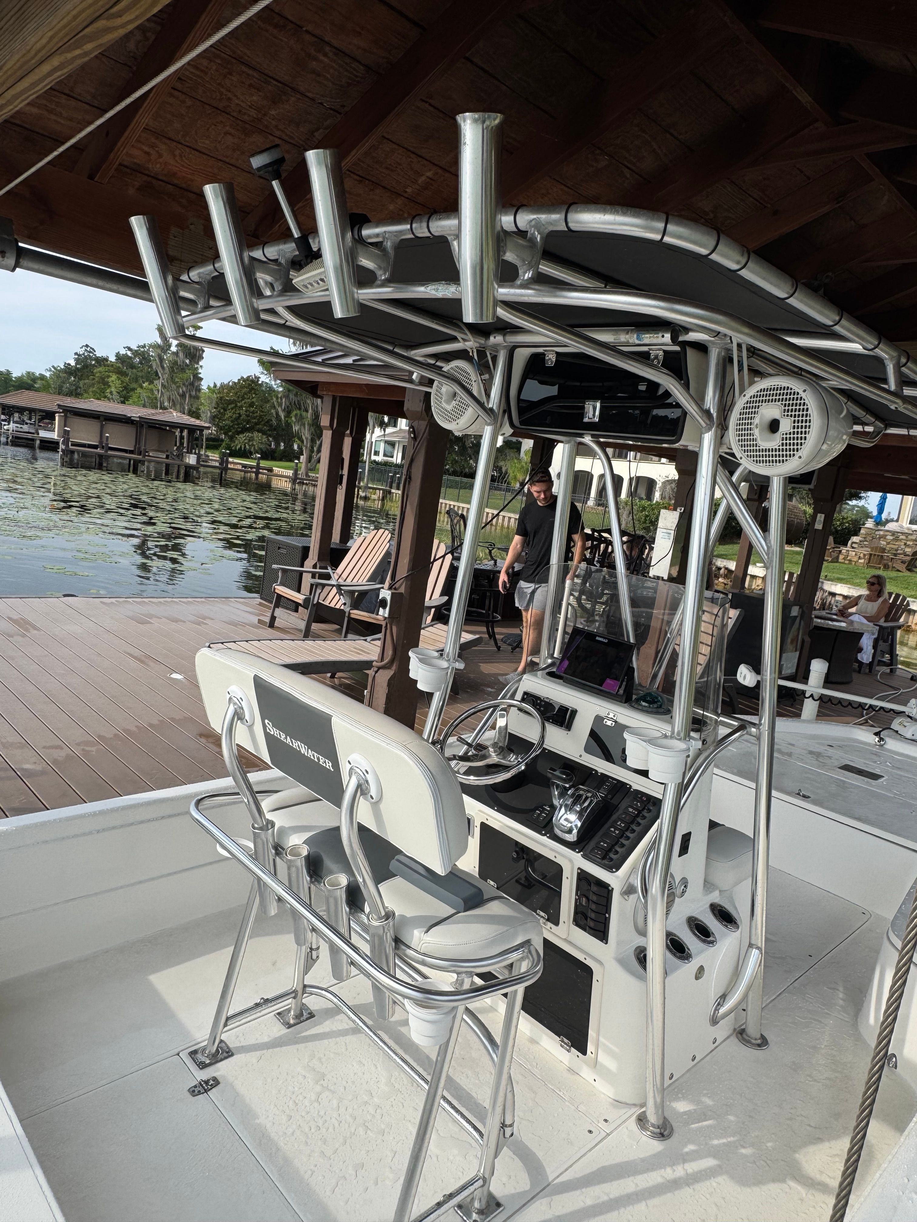2004 ShearWater LTZ boat at dock with seating area.