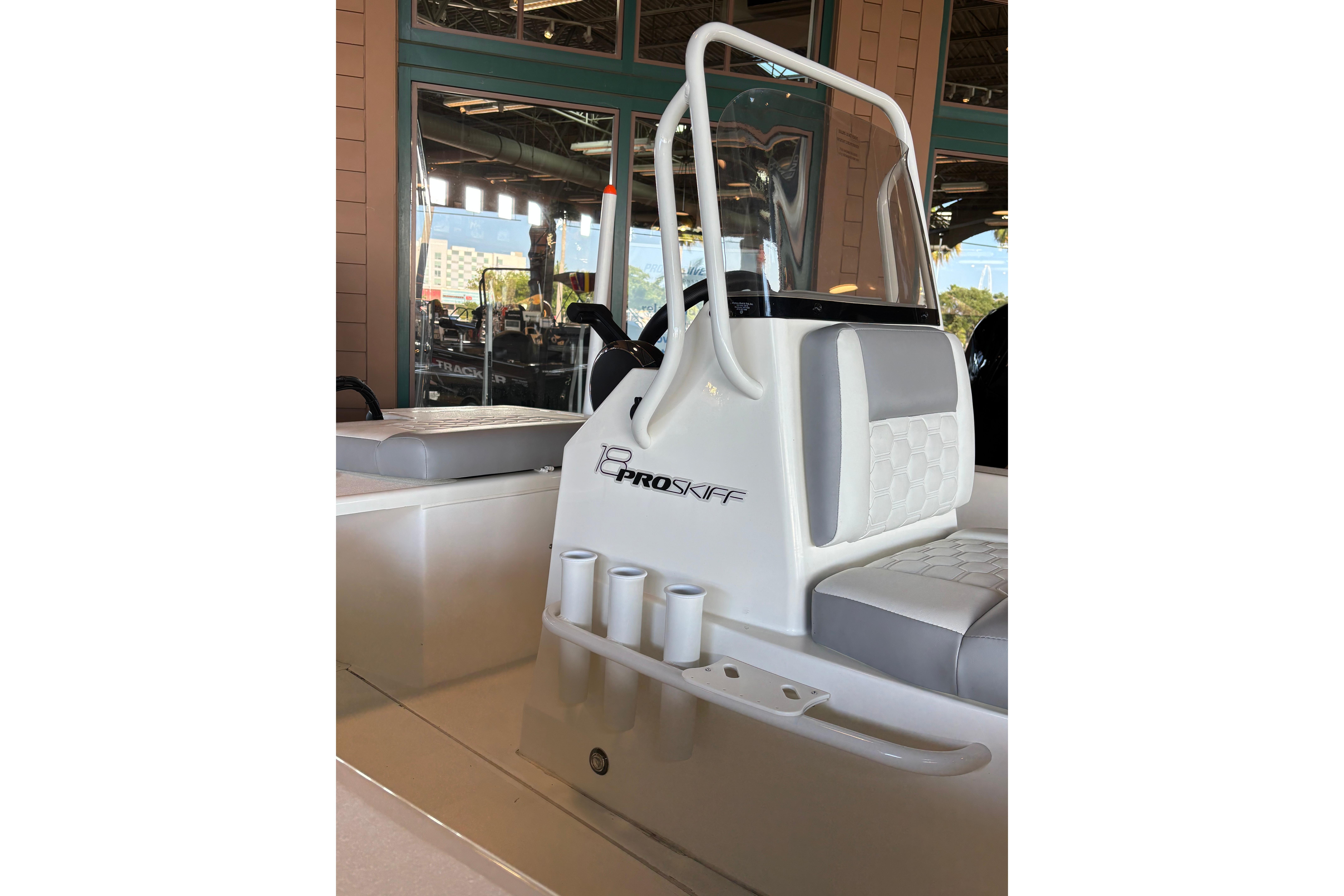 2026 Mako 18 Pro Skiff boat interior with seating and console design.