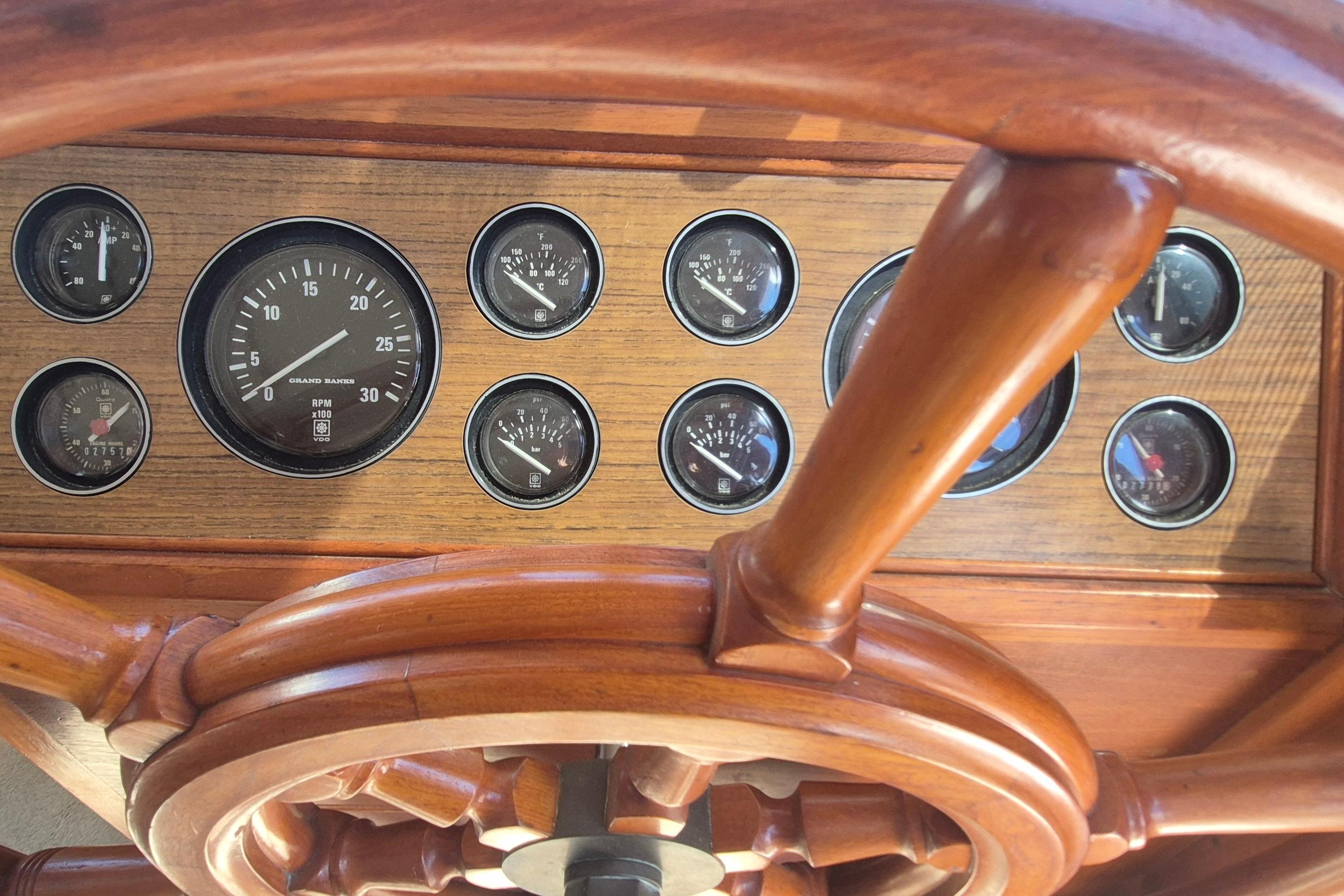 Wooden helm and gauges of 1983 Grand Banks 42 Motoryacht.