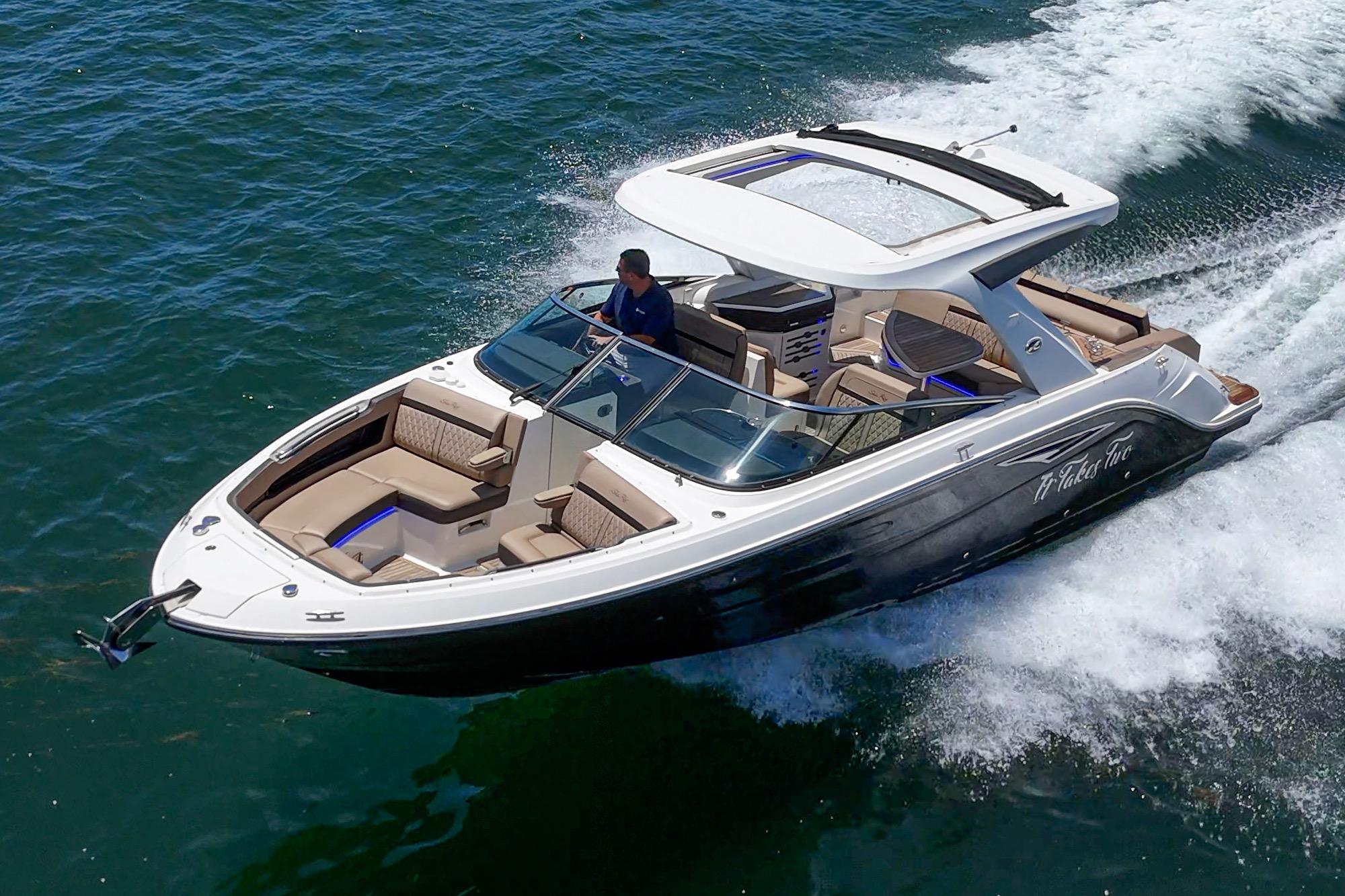 2018 Sea Ray SLX 310 cruising on open water, showcasing sleek design and luxury features.