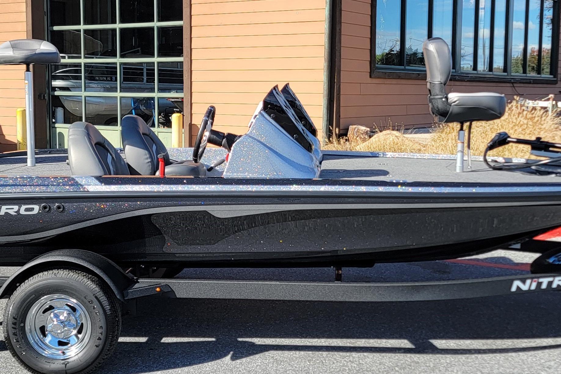 2026 Nitro Z17 boat with sleek design, parked outdoors near a building.