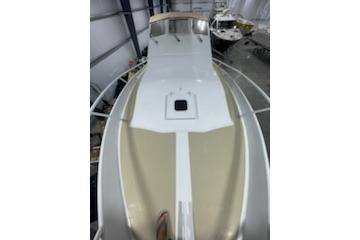 1964 Striker Model 120 boat, top view in storage, showcasing deck and cabin.