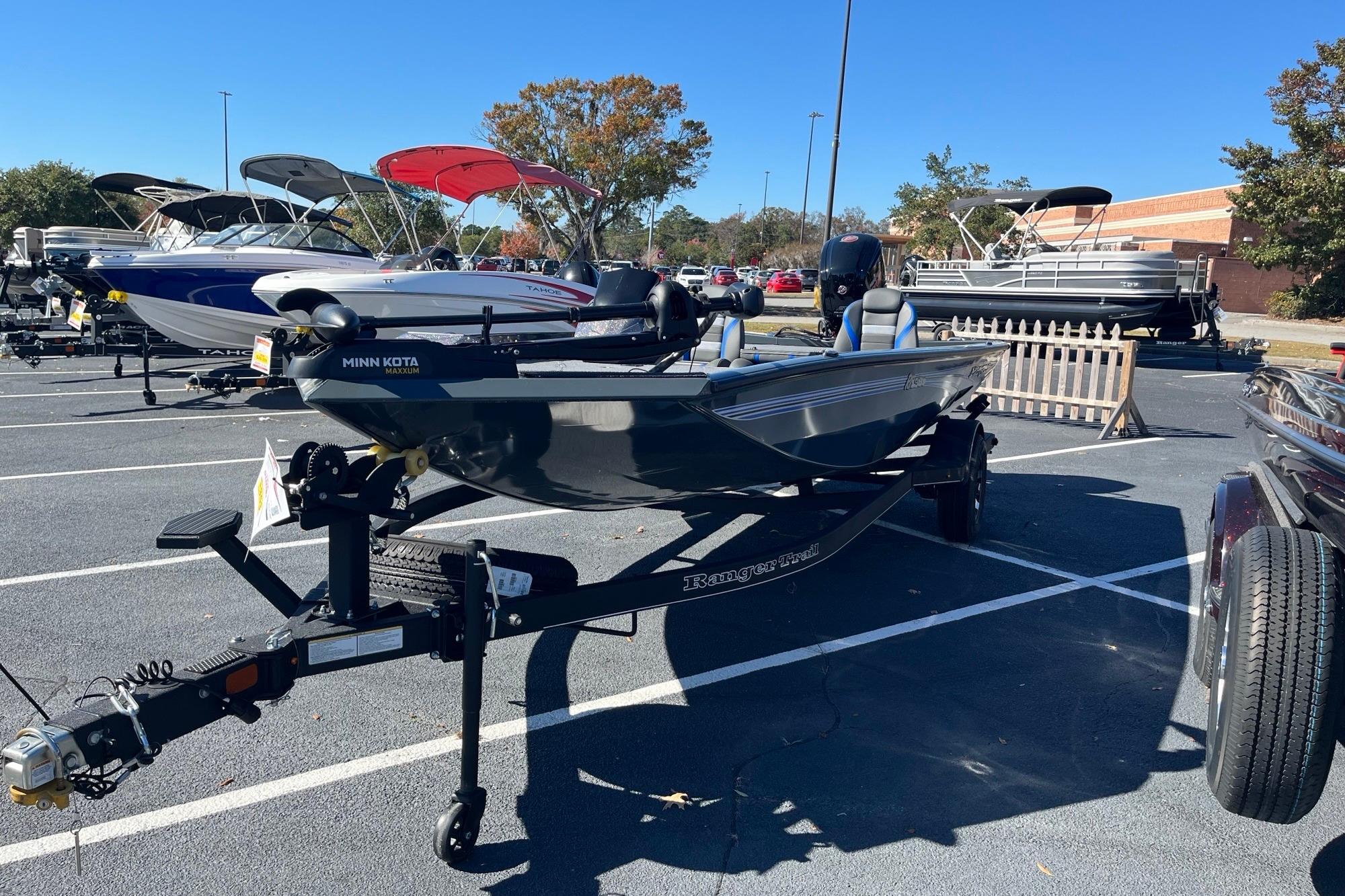 2025 Ranger RT188P boat on trailer in parking lot, surrounded by other boats.