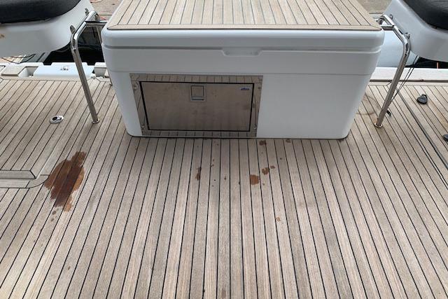 Teak deck of 2017 Hanse 588 yacht with storage compartment.