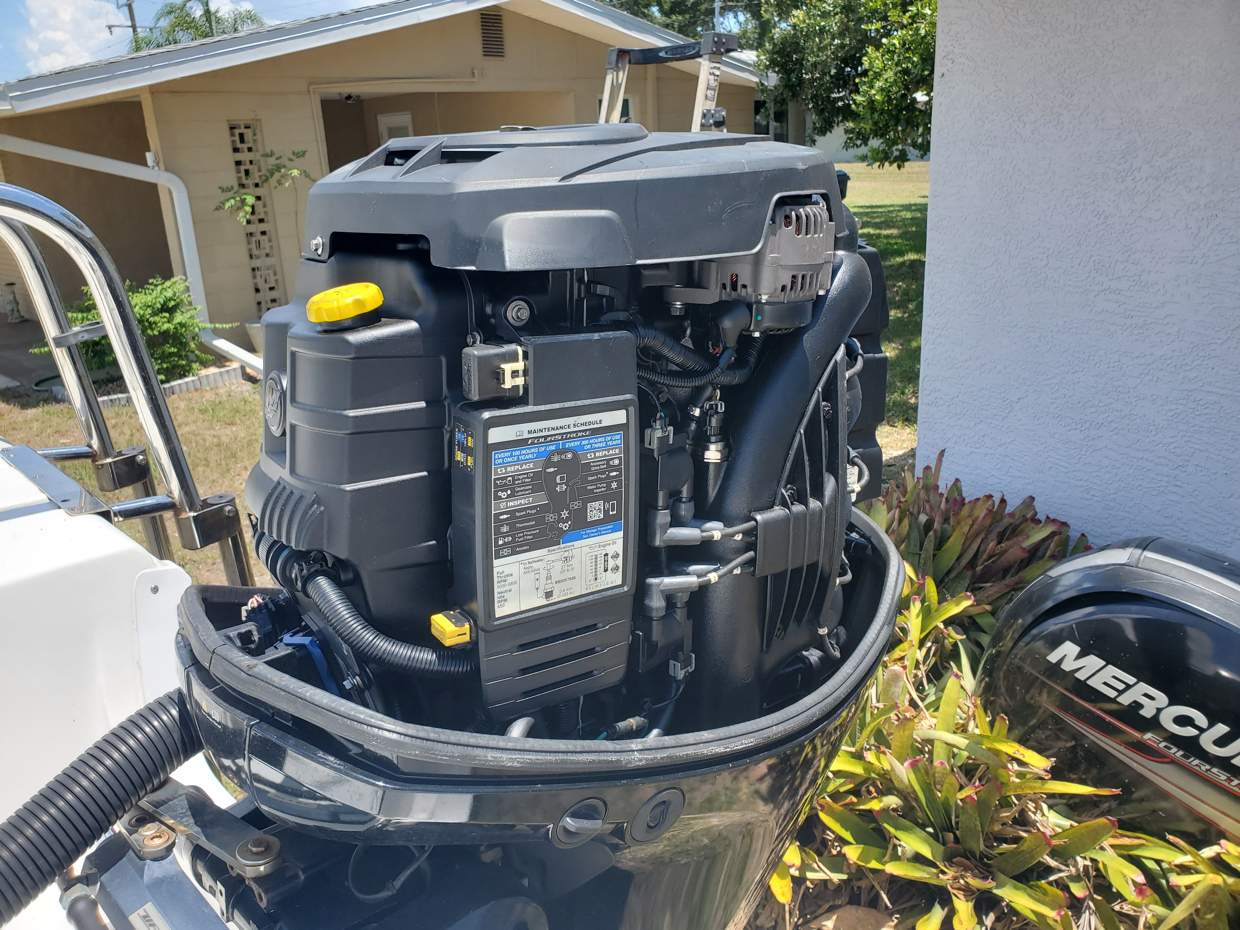 An outboard motor of a 2017 Sea Pro 219 Center Console boat is visible.