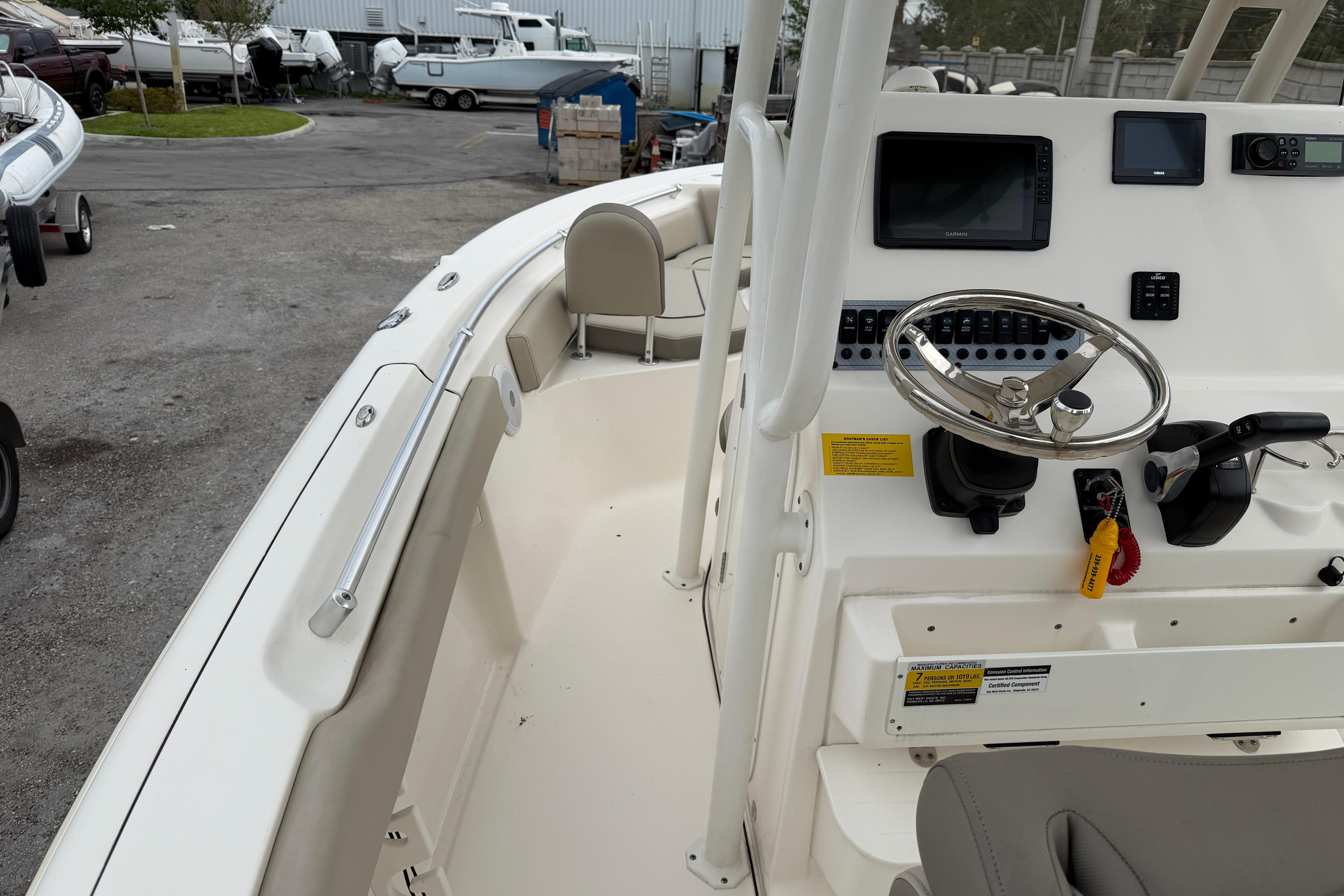 2022 Key West 219 FS boat interior with steering wheel and control panel.