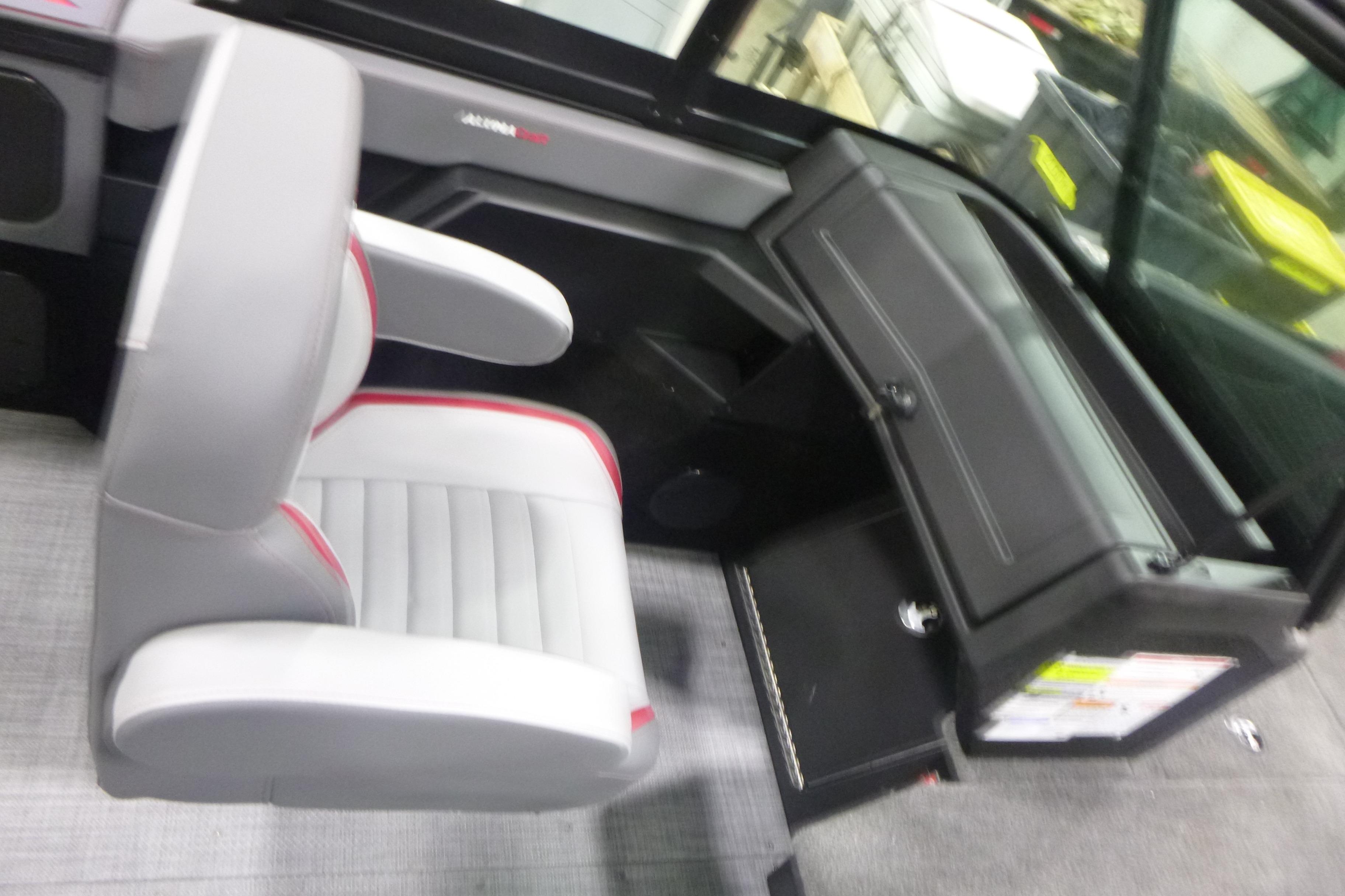2026 Alumacraft Trophy 205X Sport interior with gray seating and dashboard.