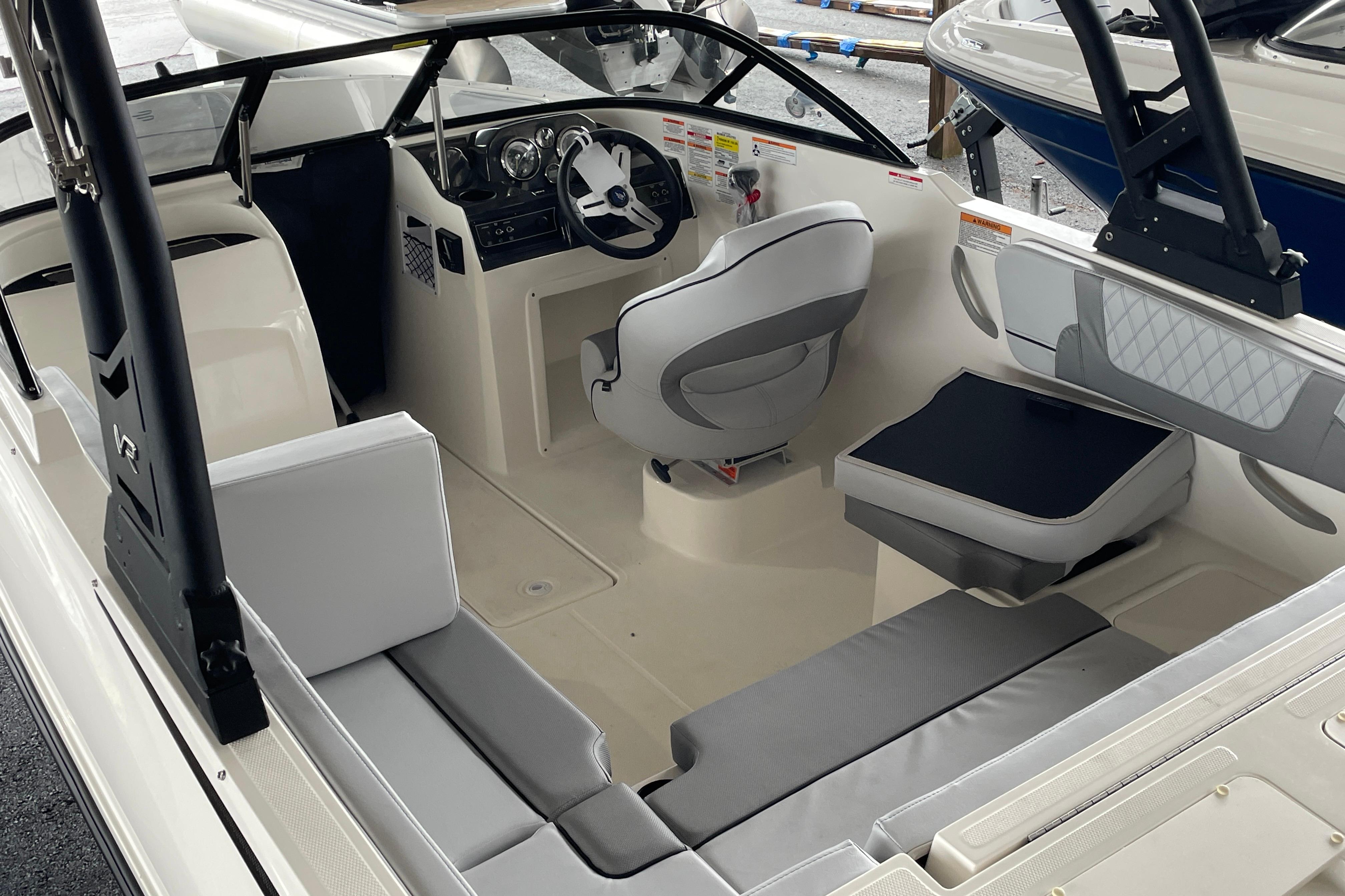 2026 Bayliner VR4 Bowrider OB interior with modern seating and steering console.