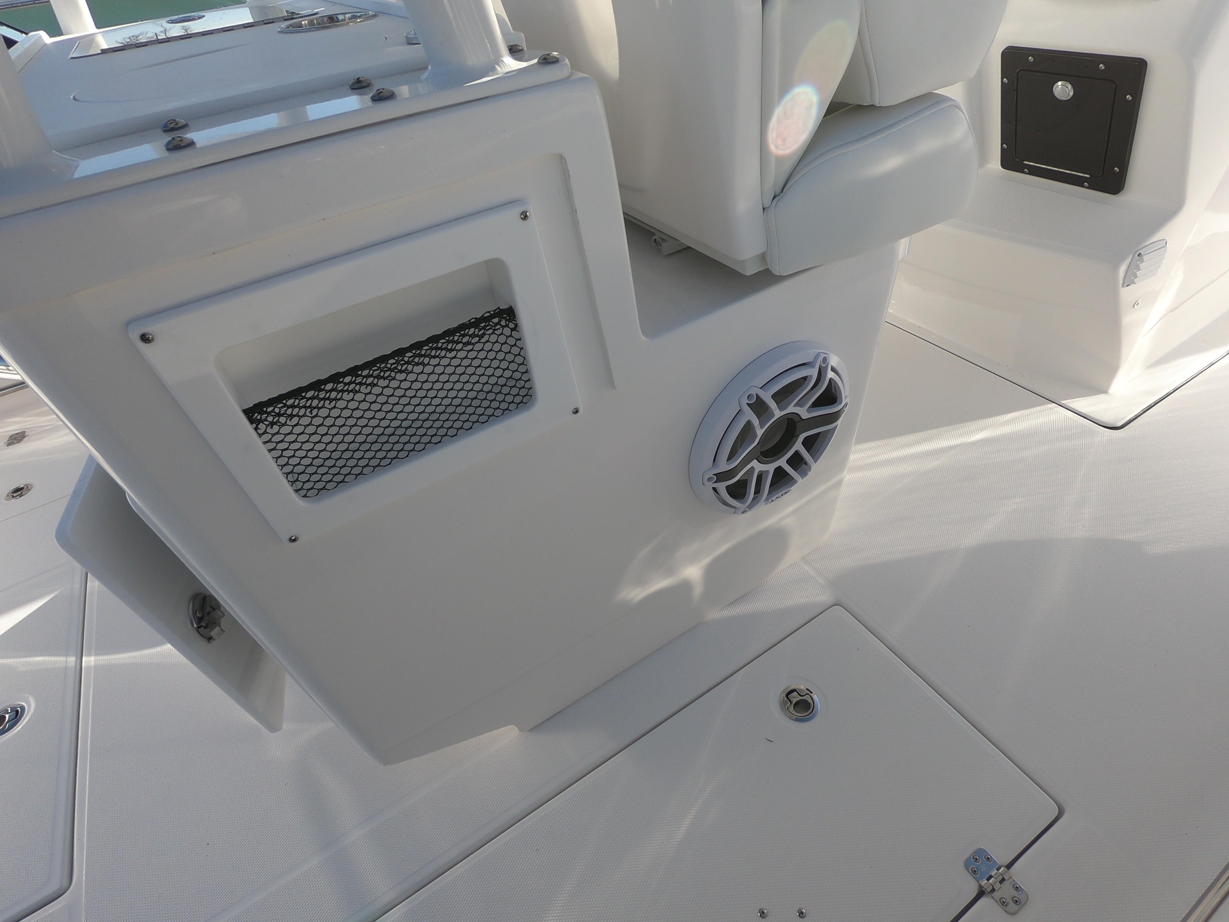 2022 Edgewater 280CC boat interior with speaker and storage compartment.