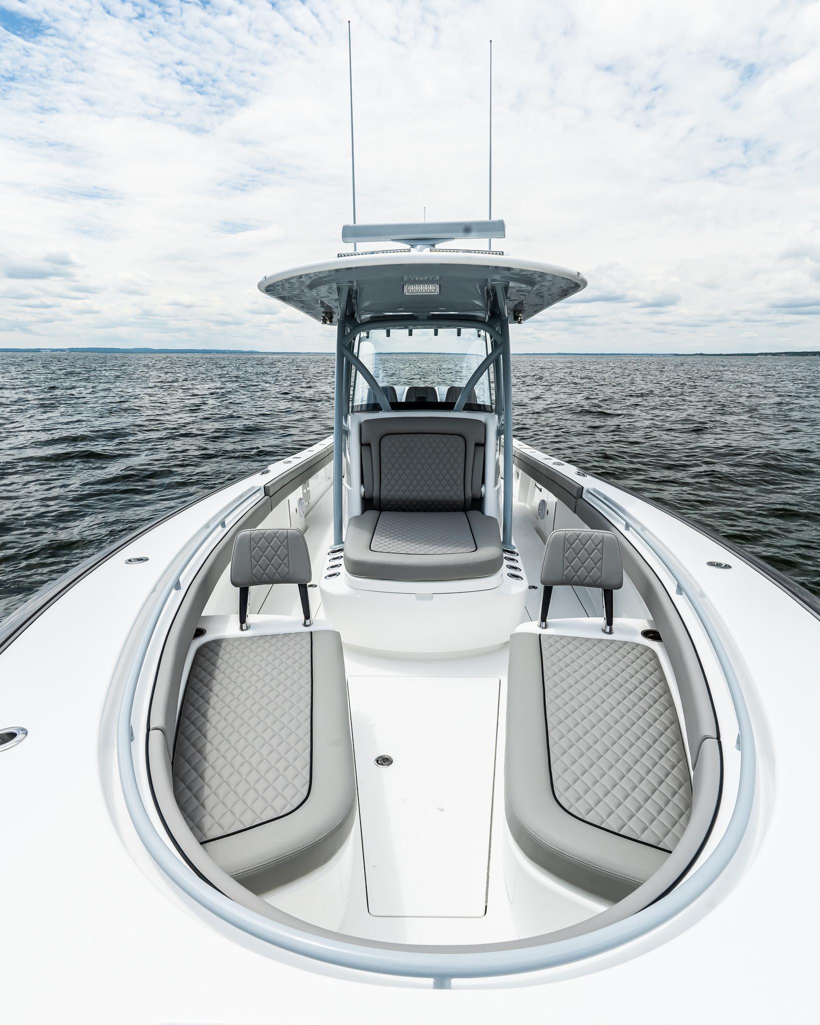 2025 Valhalla Boatworks V-33 on open water, showcasing sleek design and spacious seating.
