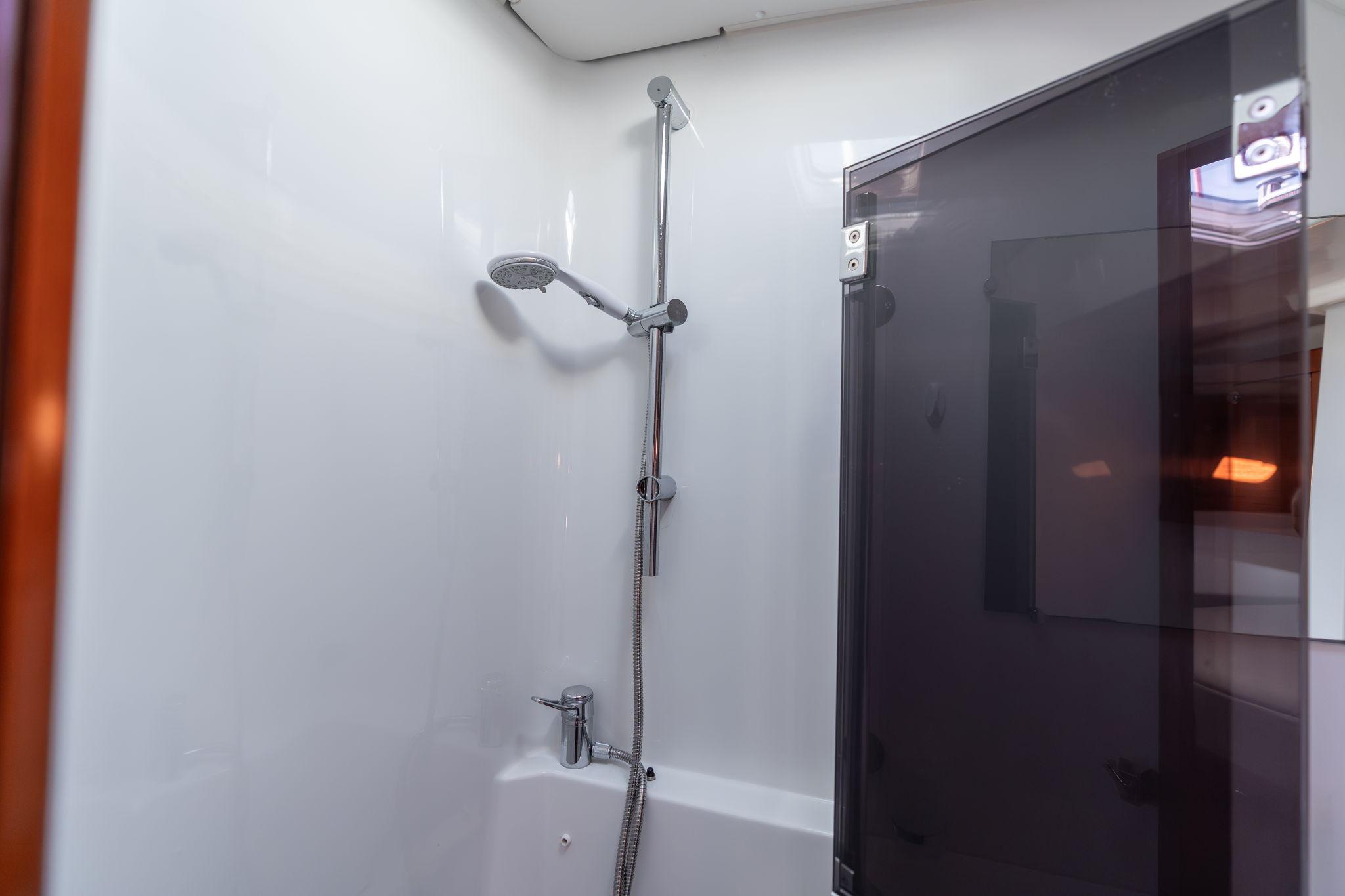 Shower area in 2013 Beneteau Oceanis 50 yacht, featuring modern fixtures and sleek design.