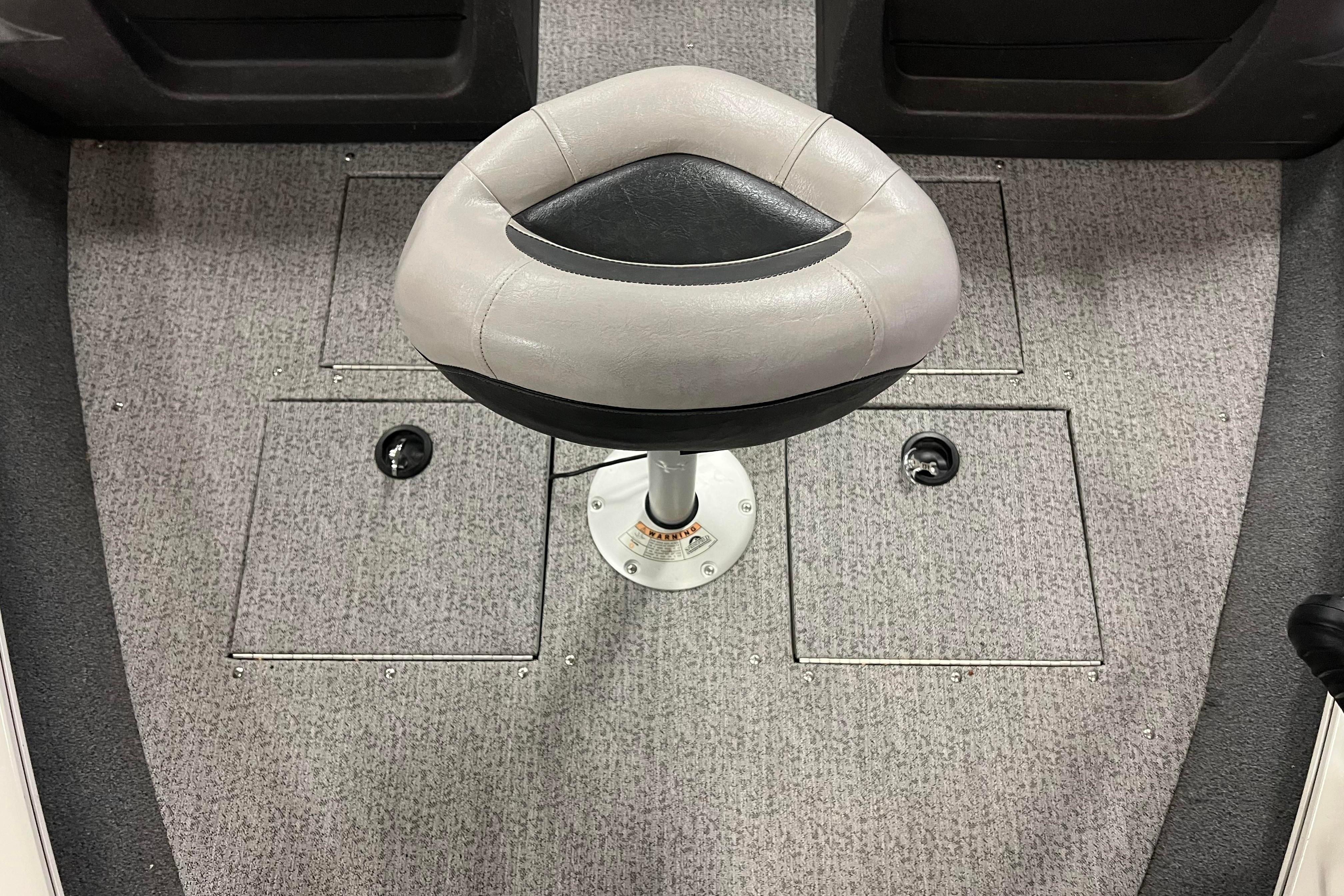 2022 Tracker Pro Guide V-16 WT boat seat on carpeted deck.