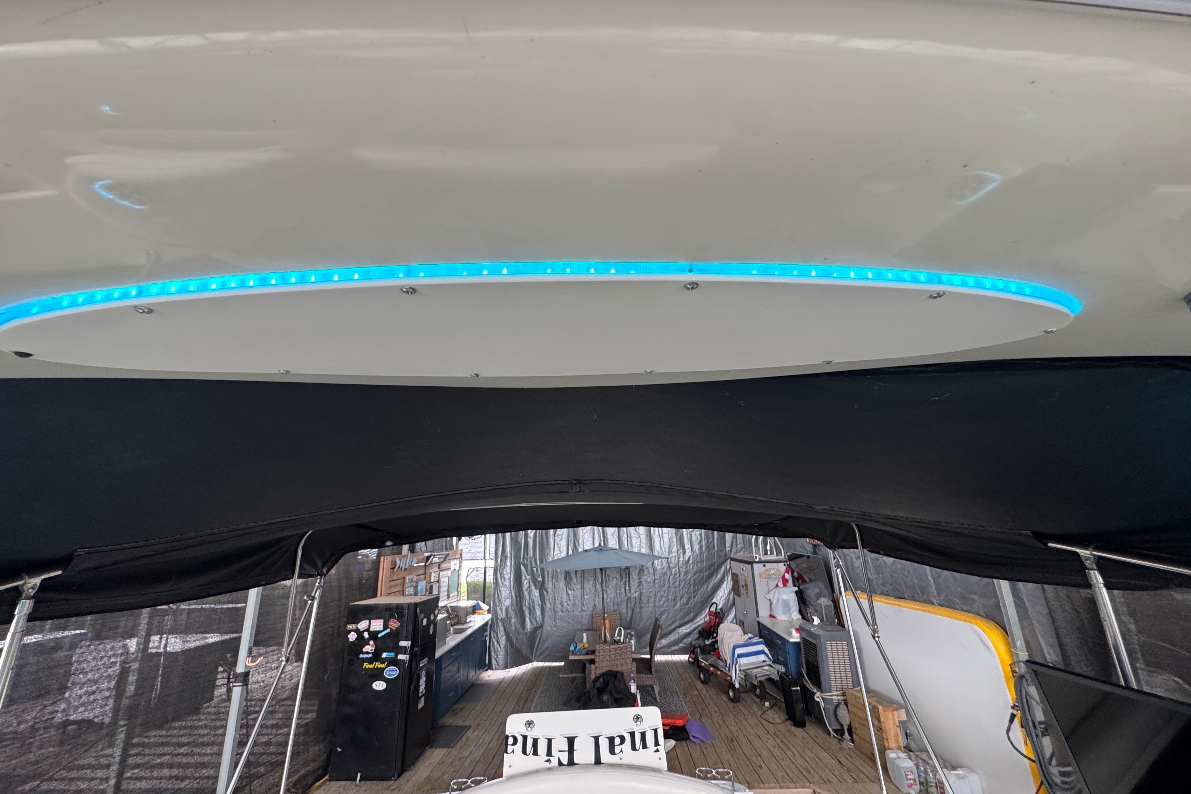 2001 Sea Ray 380 Sundancer interior with blue LED lighting and covered deck area.