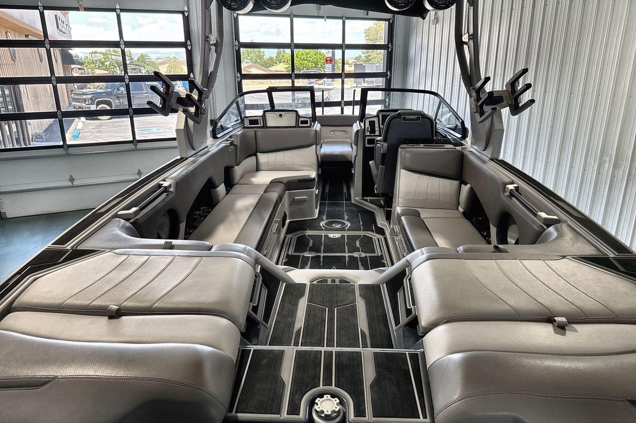 Luxurious interior of a 2021 Supra SE 550 boat with sleek seating and modern design.