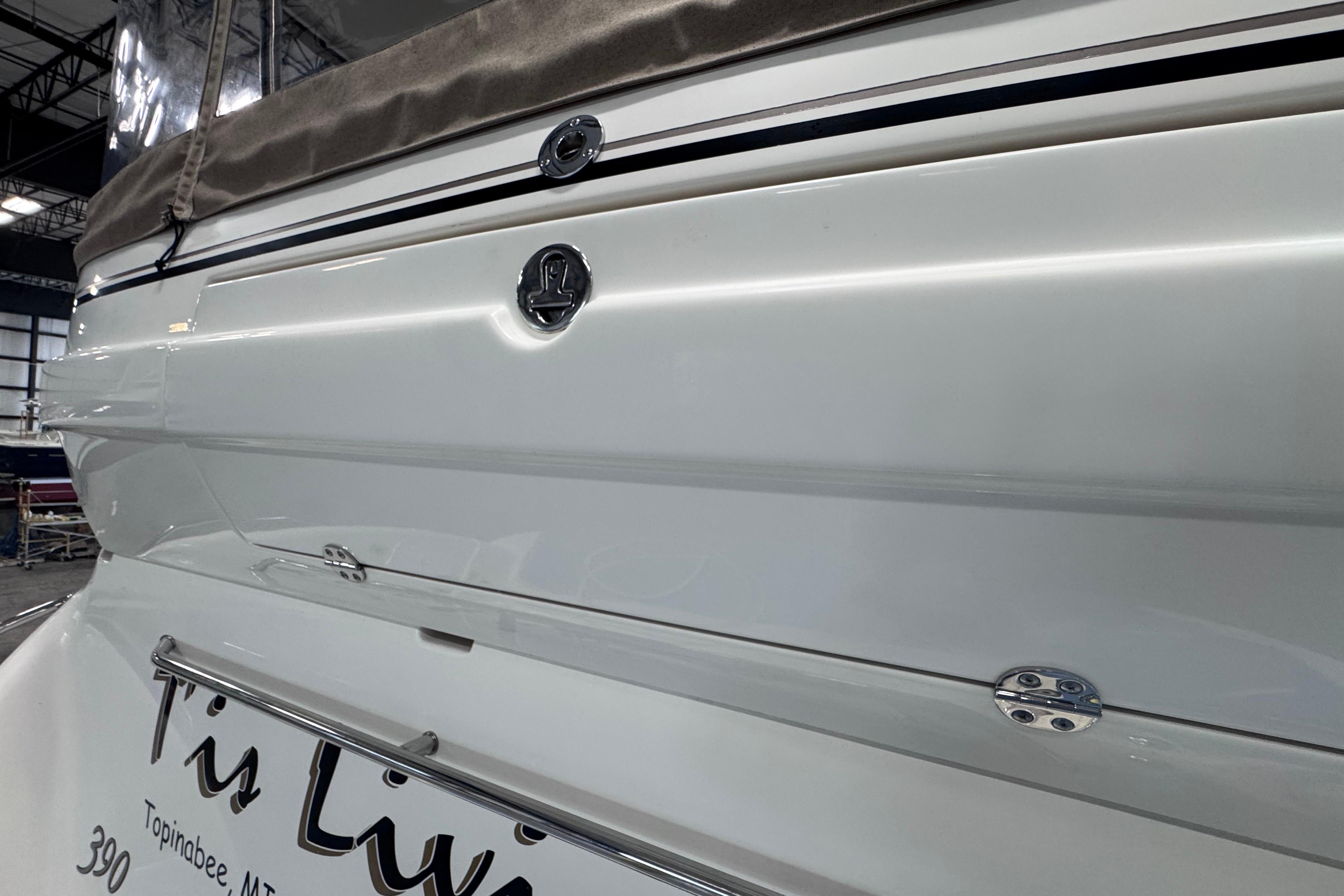 2004 Sea Ray 390 Motor Yacht stern view in a marina setting.