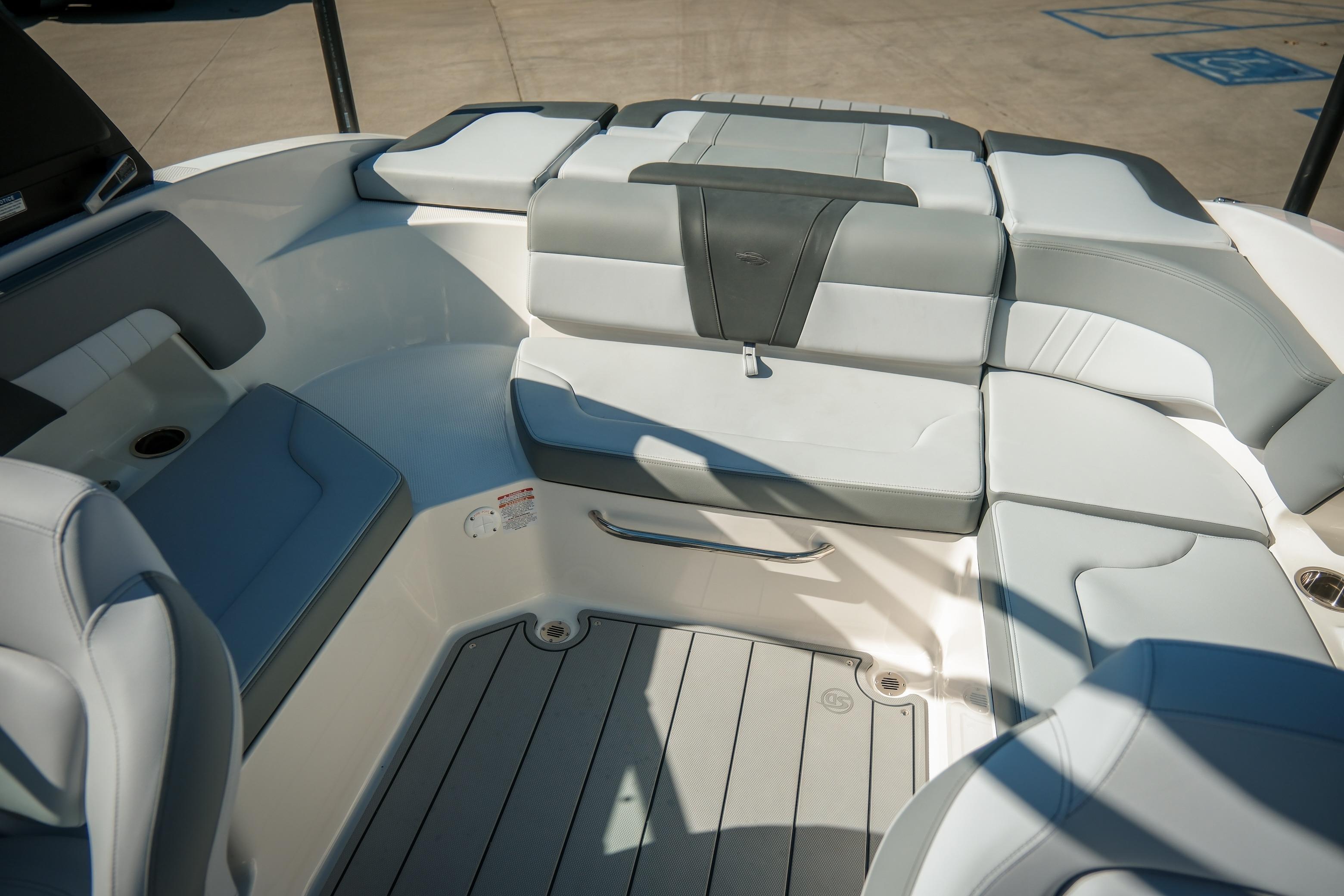 2026 Chaparral 23 SSi boat interior with gray and white seating, spacious layout.