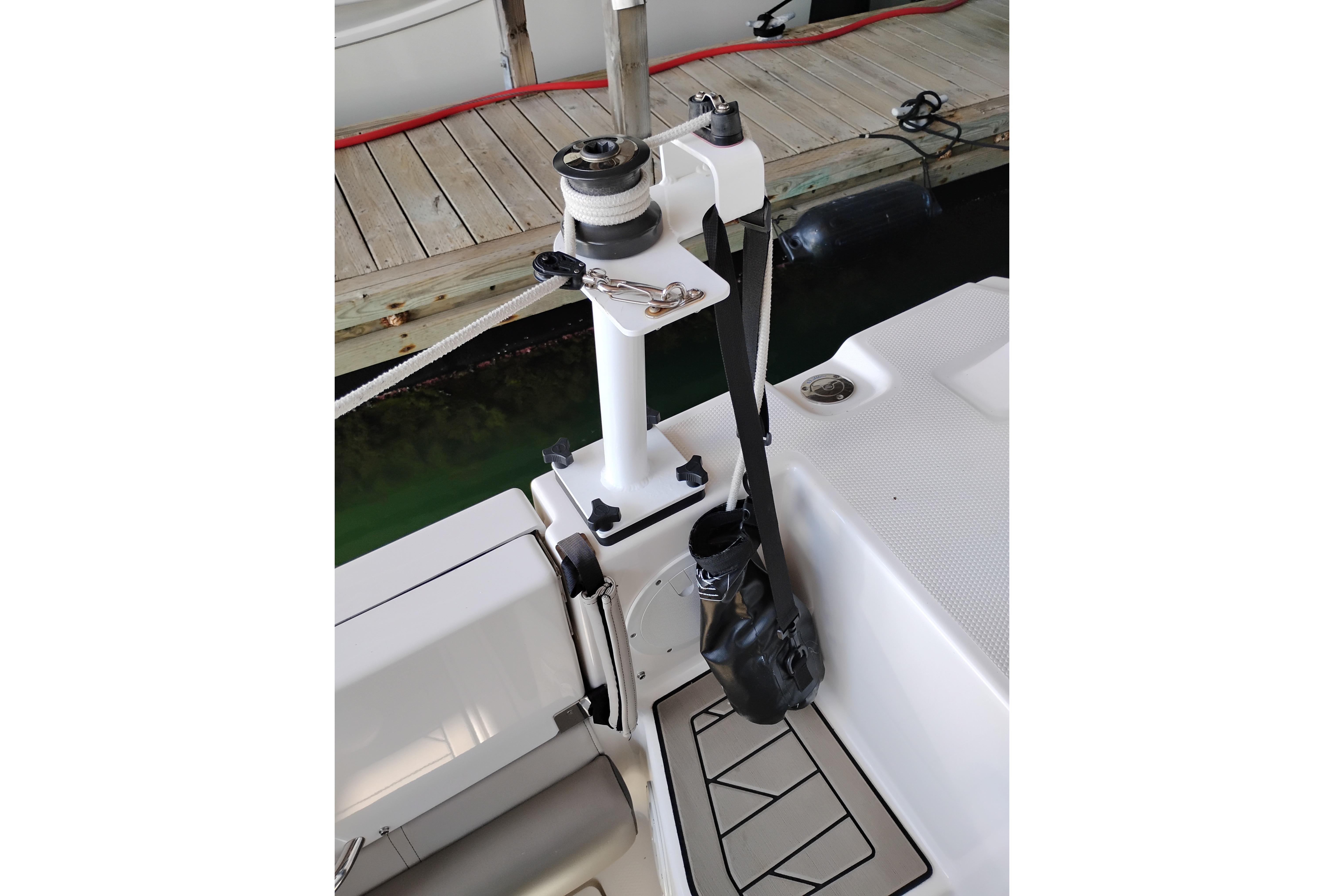 2022 Cutwater C-32 Coupe boat deck with winch and dock view.