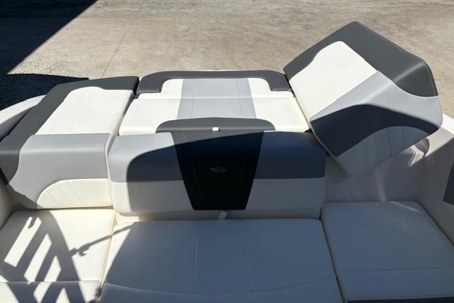 2023 Chaparral 21 SSi boat interior with gray and white cushioned seating.