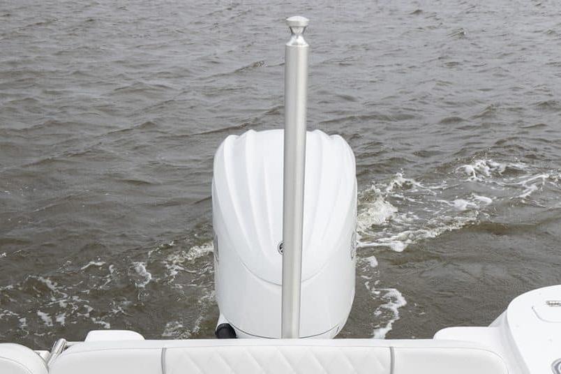 2027 Sea Fox 248 Commander boat engine on water, rear view.