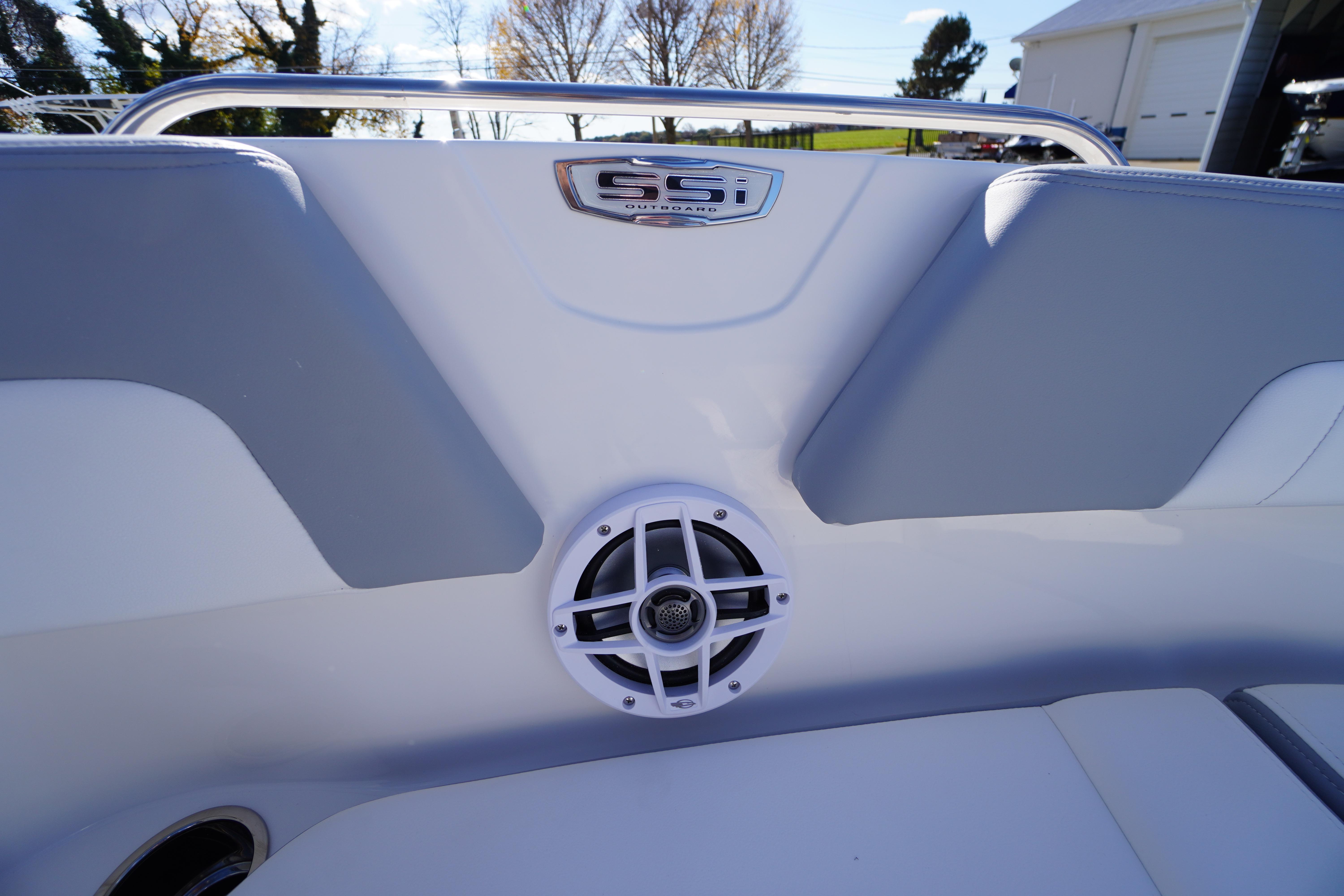 2026 Chaparral 23 SSi OB boat interior with speaker and logo detail.