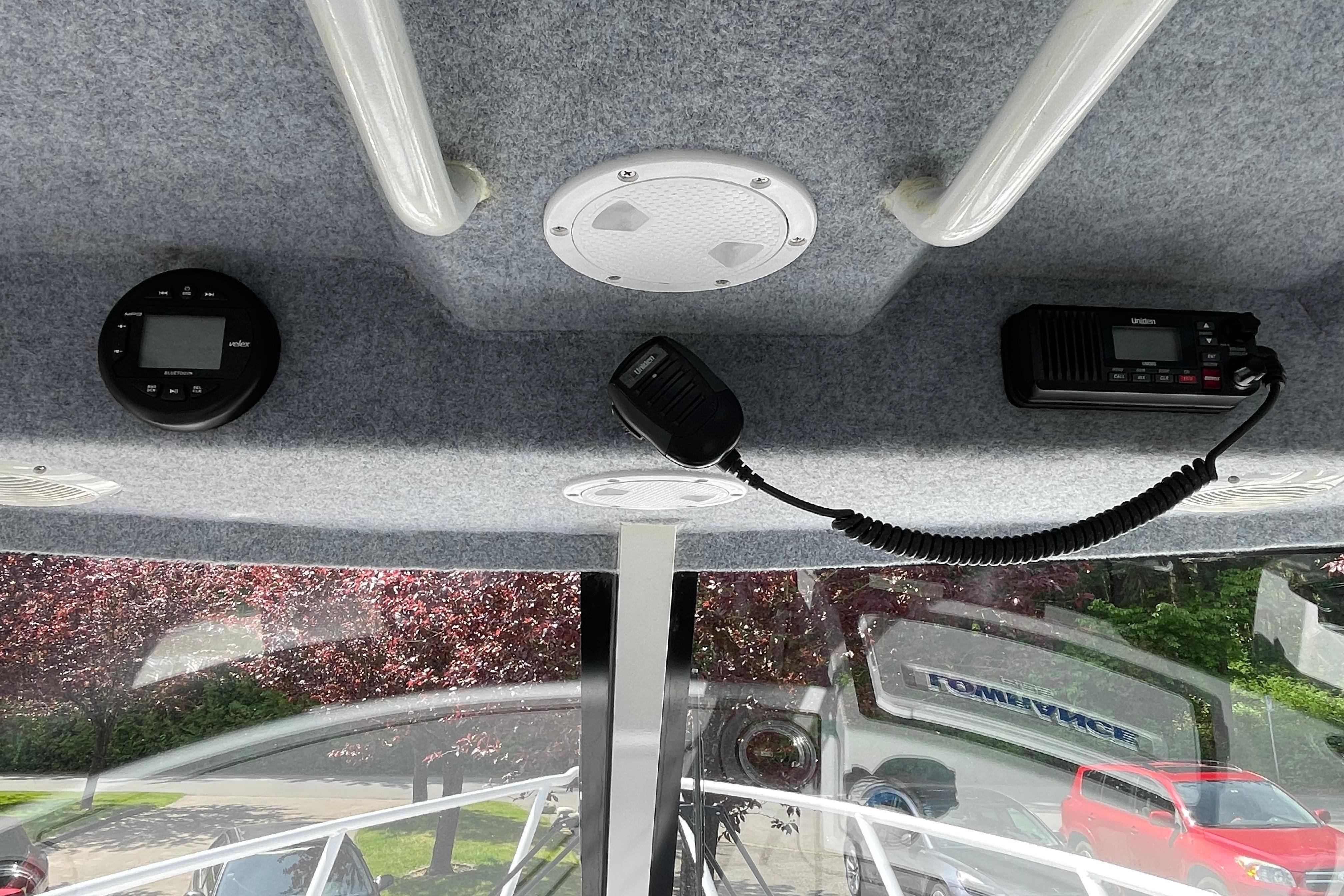 Interior view of 2025 Custom Aluminum 7.5 Profisher boat with communication equipment.