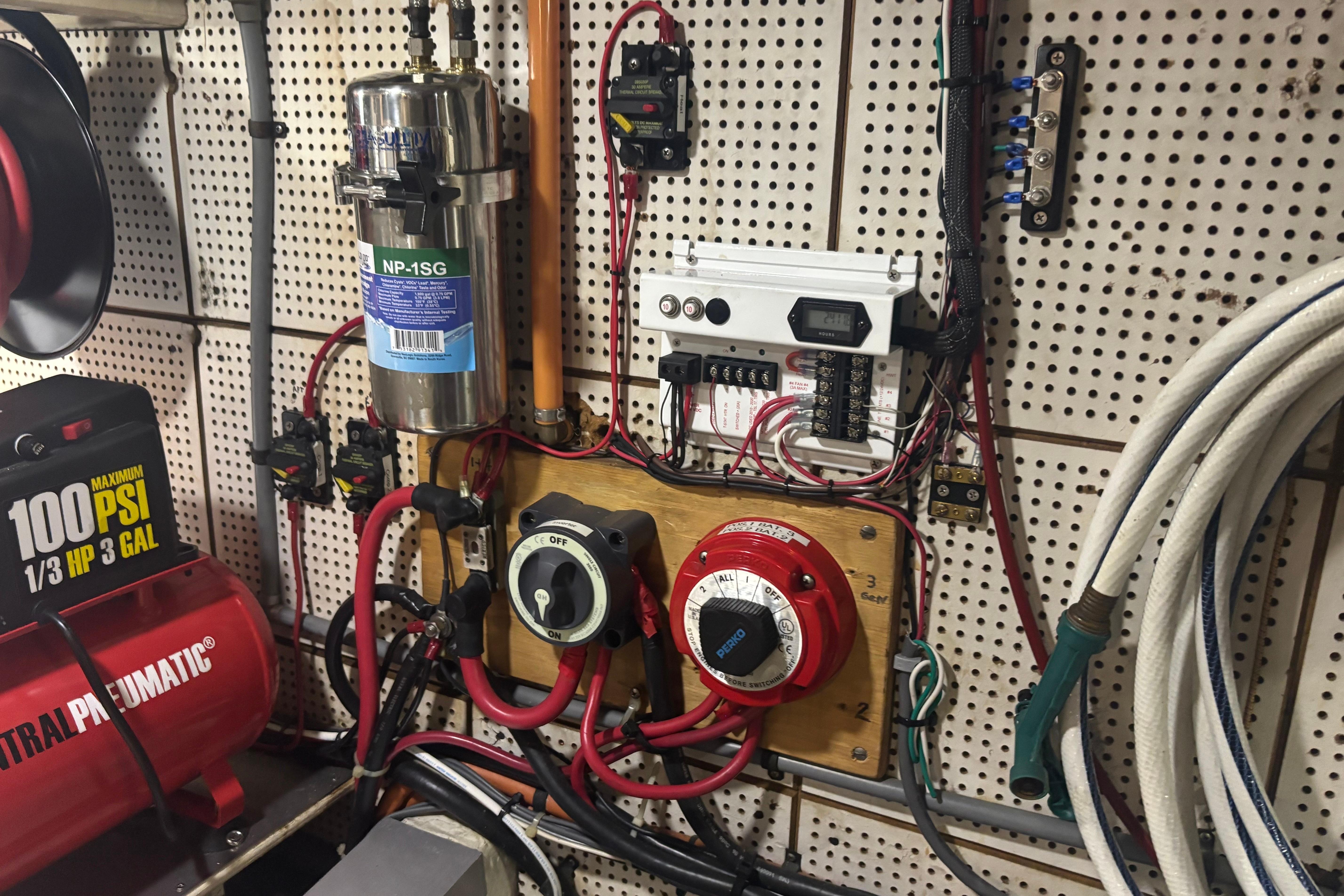 Electrical system setup in a 1989 Grand Banks 46 Classic boat engine room.