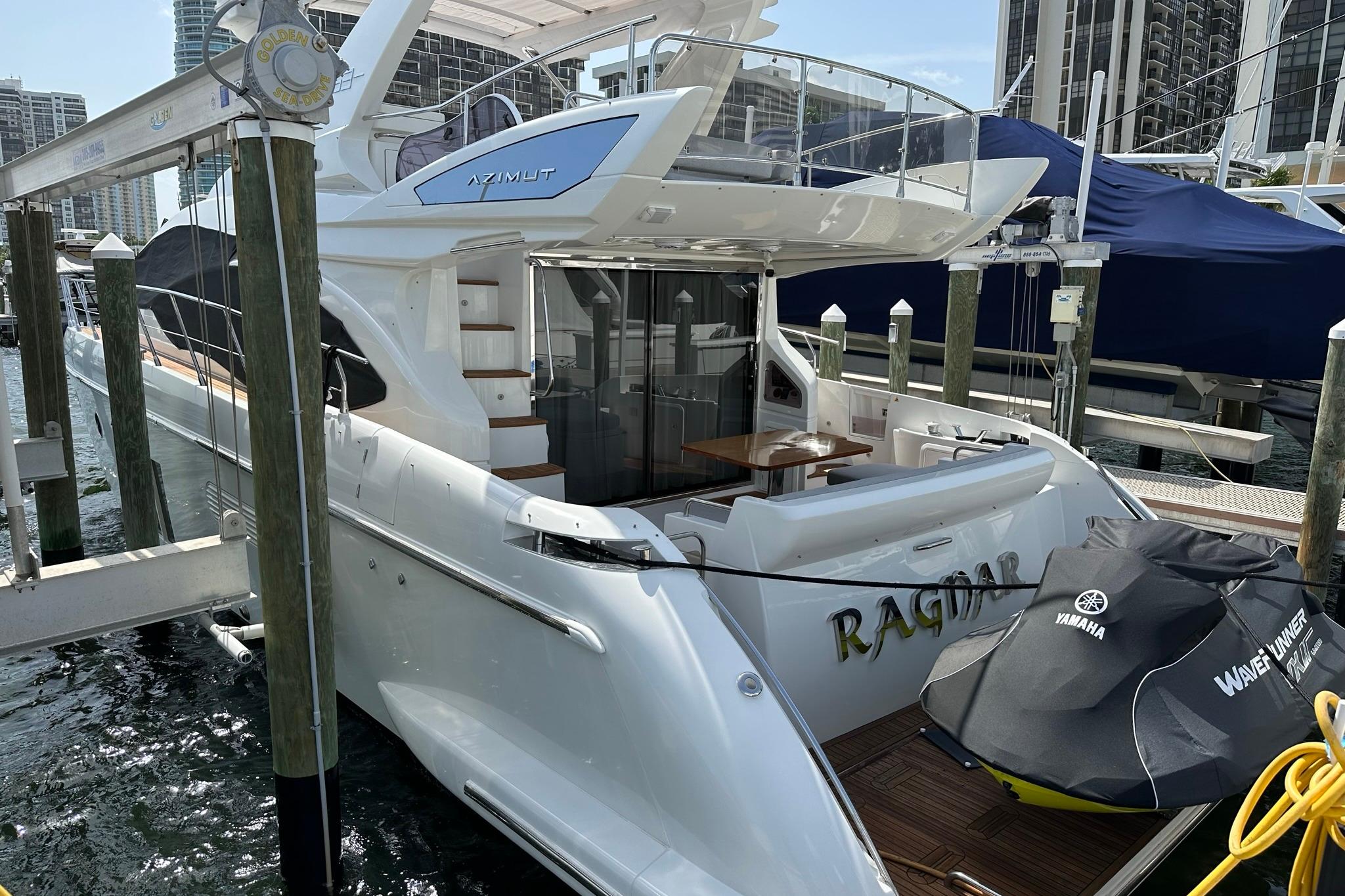 2013 Azimut Fly 53 yacht docked, featuring sleek design and Yamaha WaveRunner.