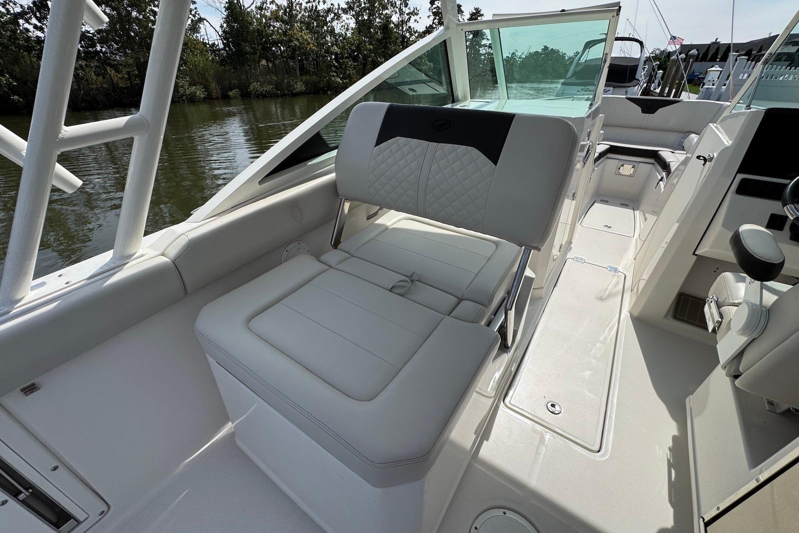 2022 Sailfish 276 DC boat interior with cushioned seating and sleek design.