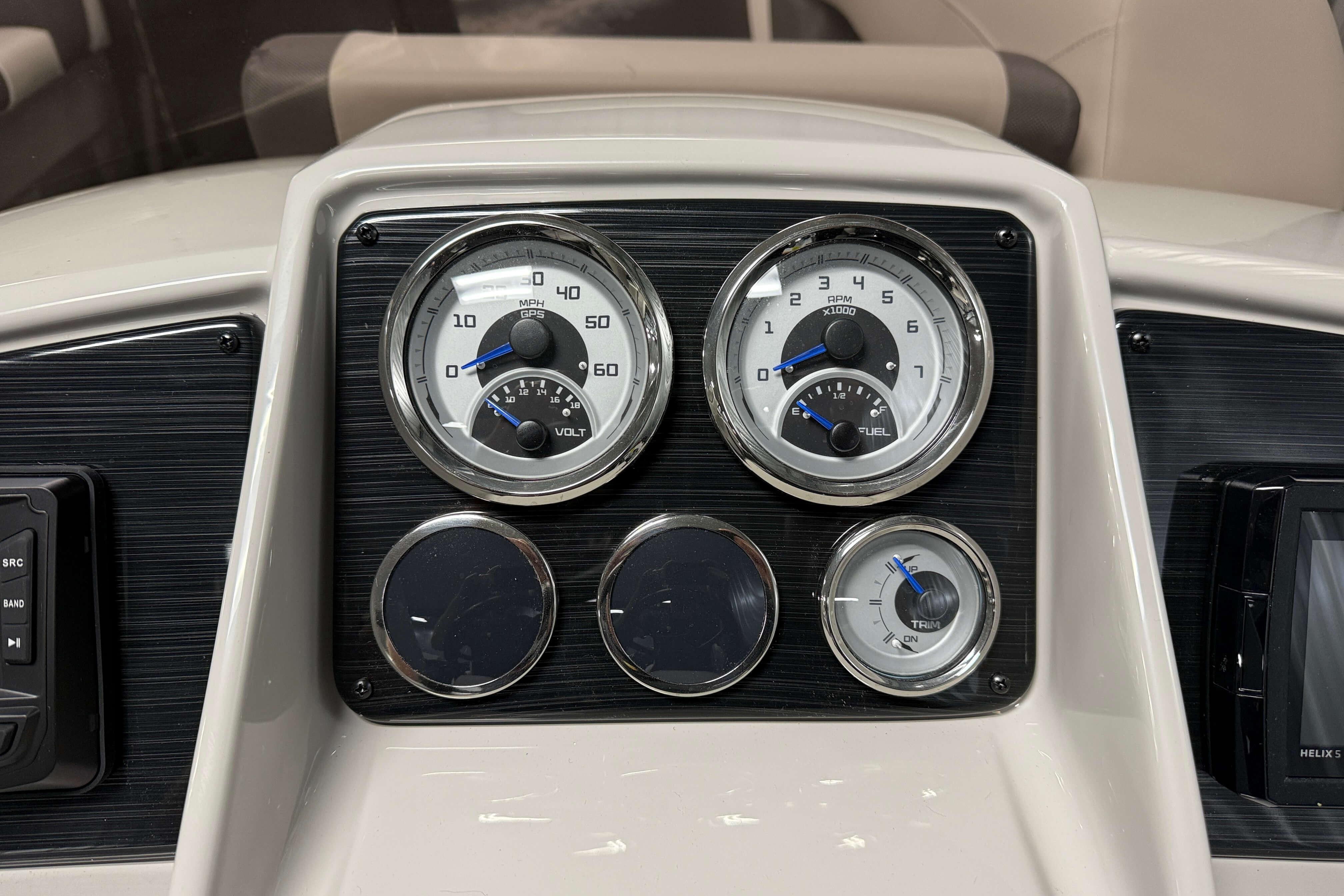 Dashboard of 2026 Sylvan Mirage X1 boat with gauges and controls.