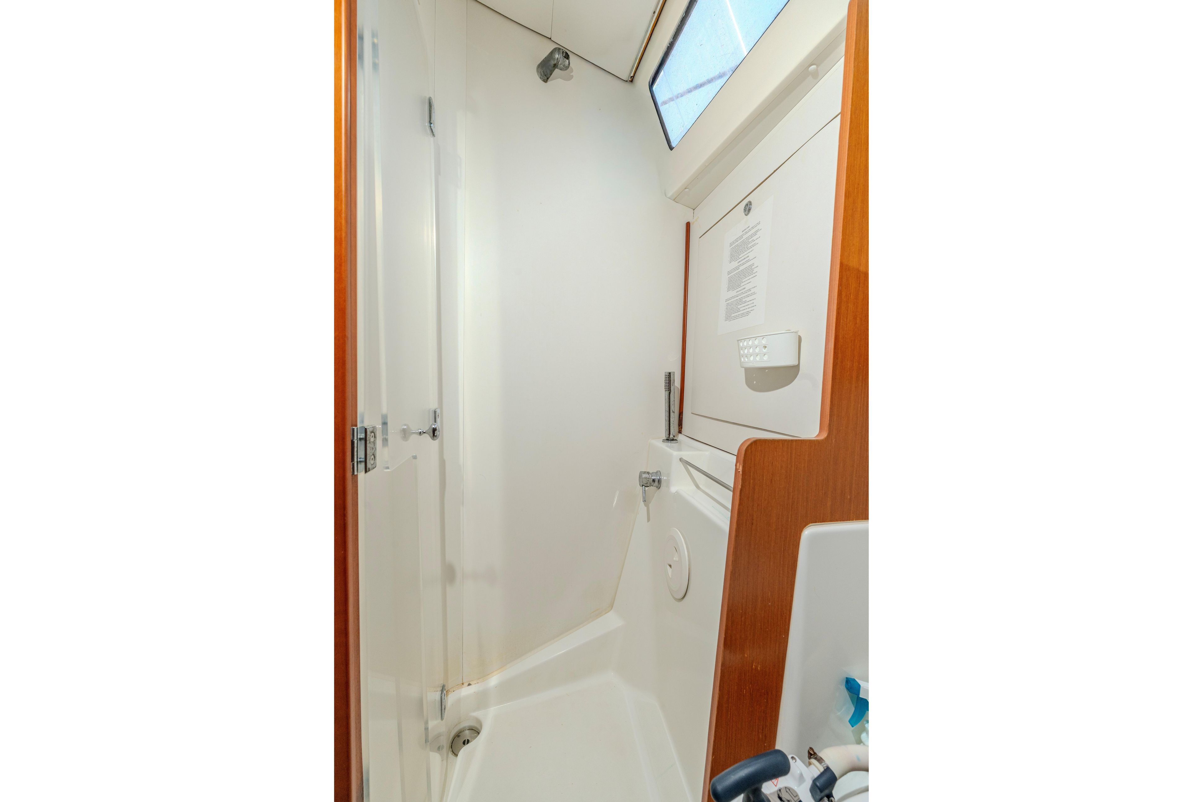 Interior shower area of 2013 Beneteau Oceanis 41 sailboat, featuring sleek design and wooden accents.