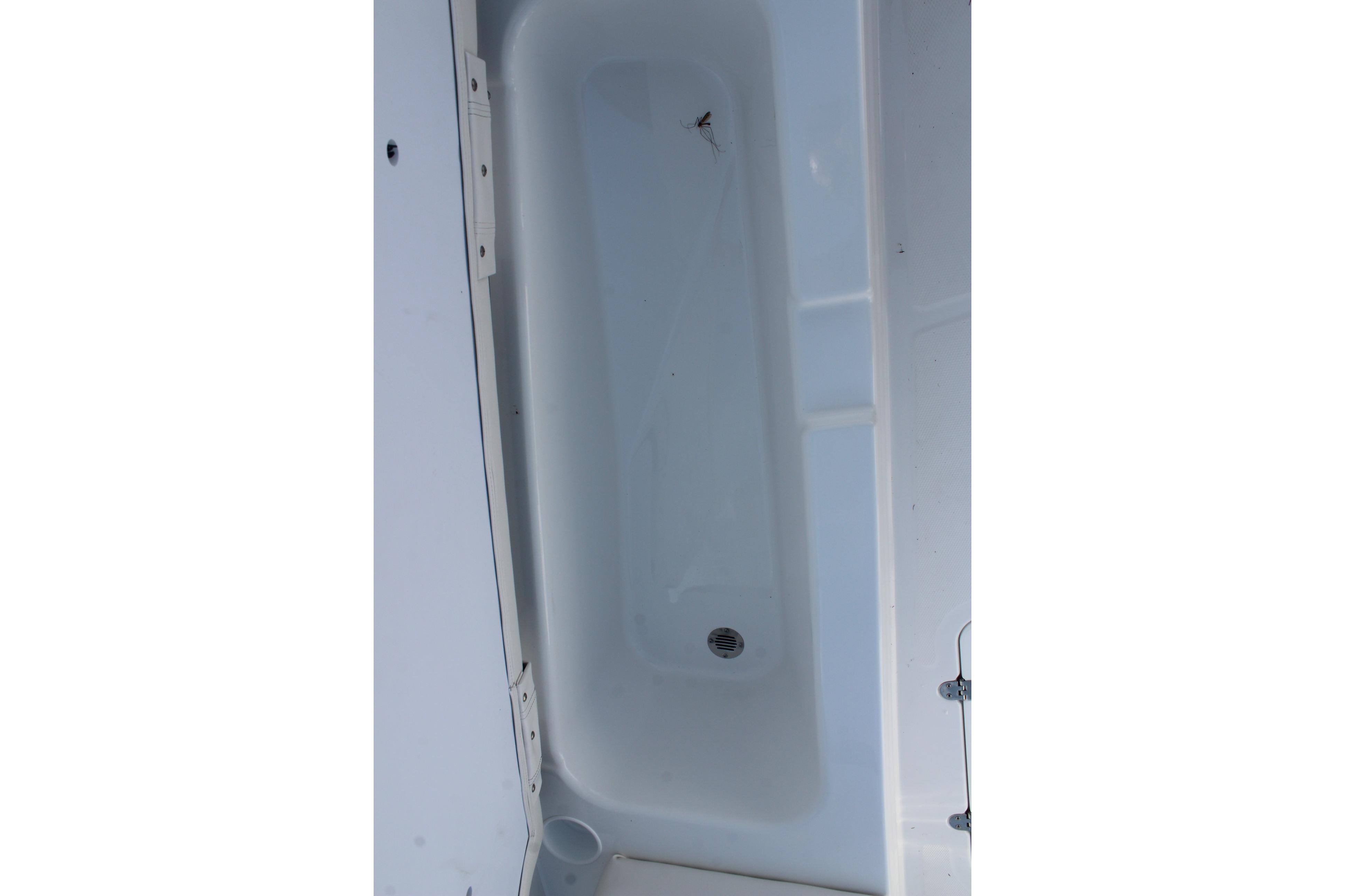 Interior view of a 2026 Tahoe T18 boat compartment with drain.