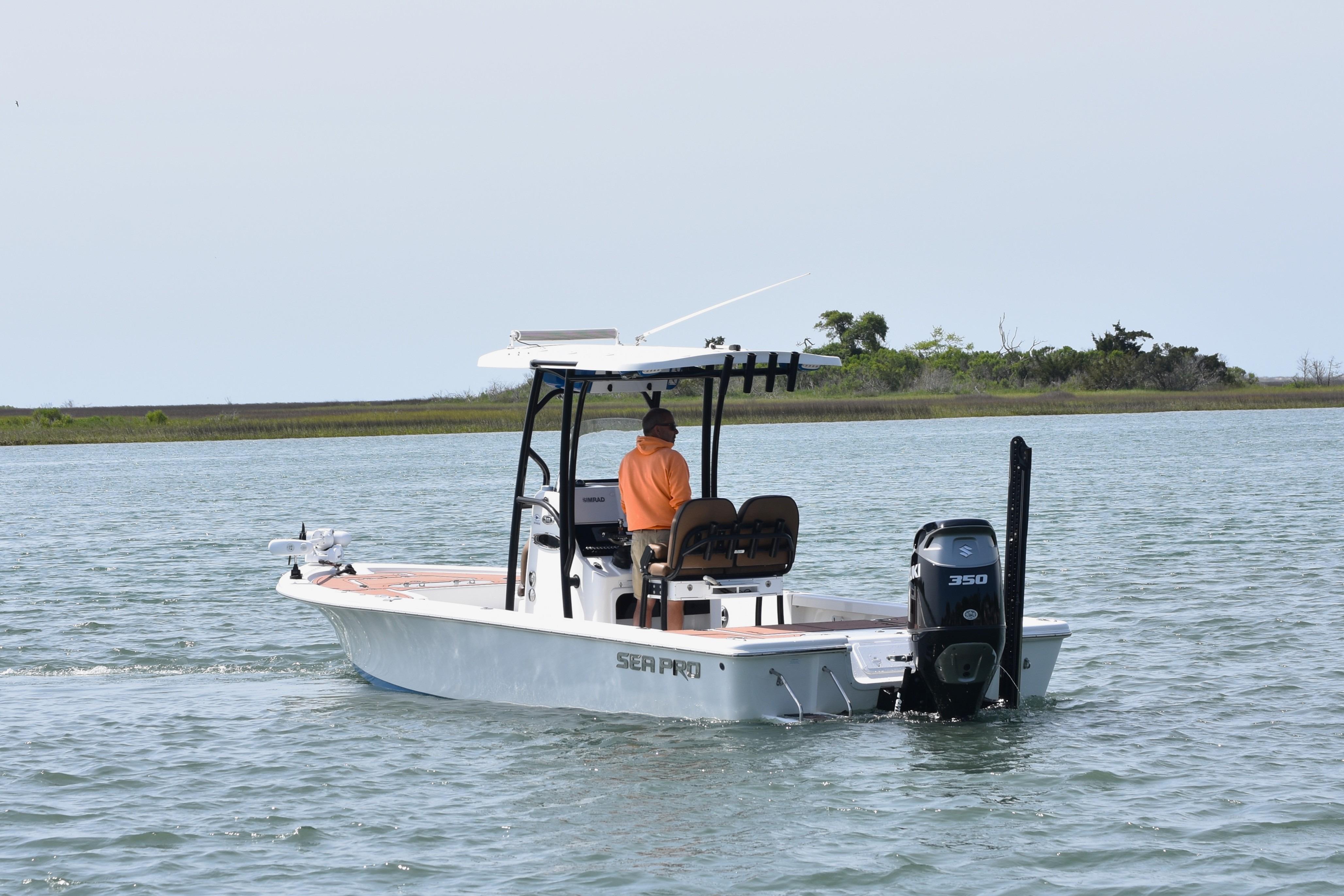 2018 Sea Pro 248 Bay boat cruising on calm water with a person onboard.