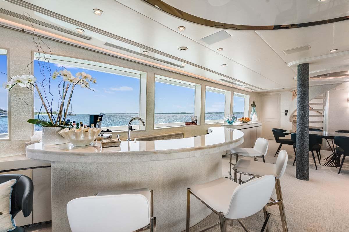 Luxurious 2001 Westship Skylounge interior with elegant bar and ocean views.