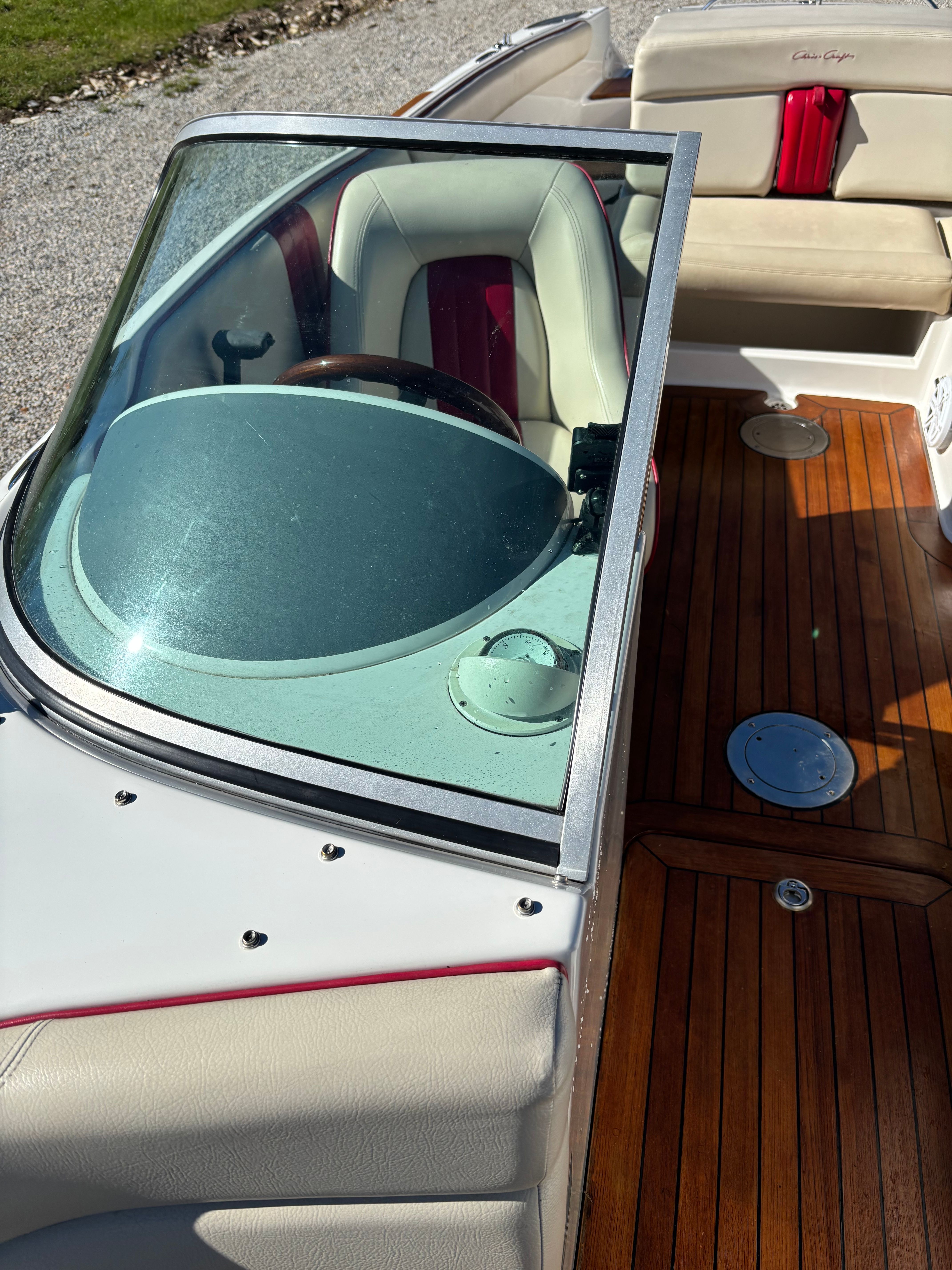 2003 Chris-Craft Launch 22 with polished wood flooring and comfortable seating.