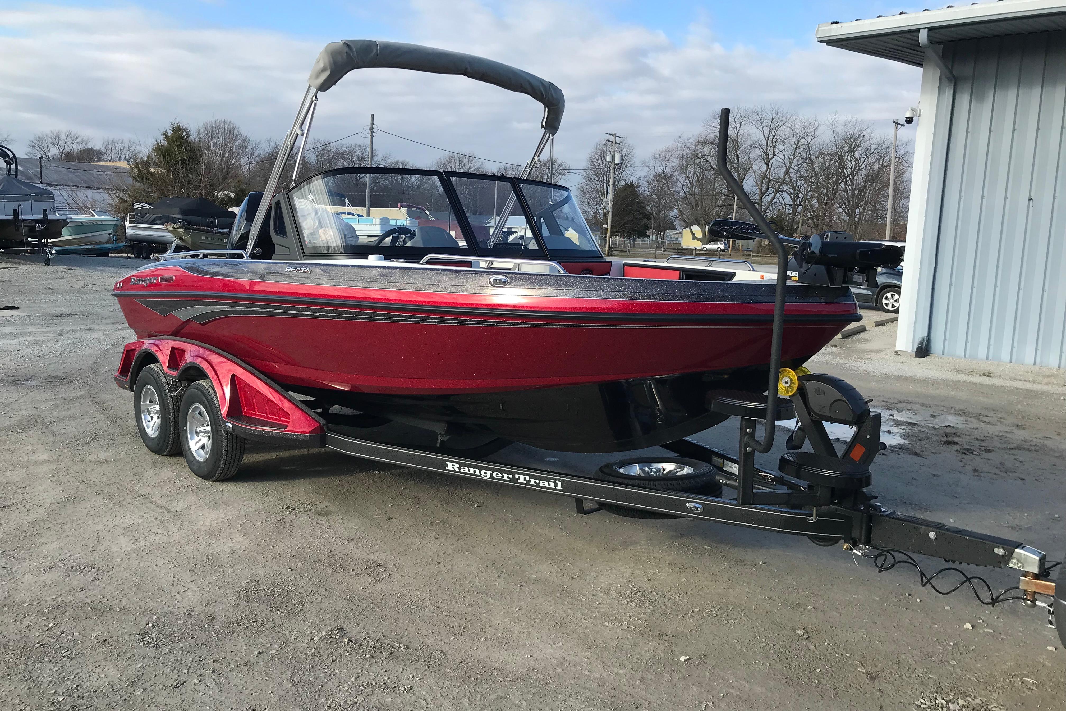 2026 Ranger 1850MS boat on trailer, red exterior, parked outdoors.