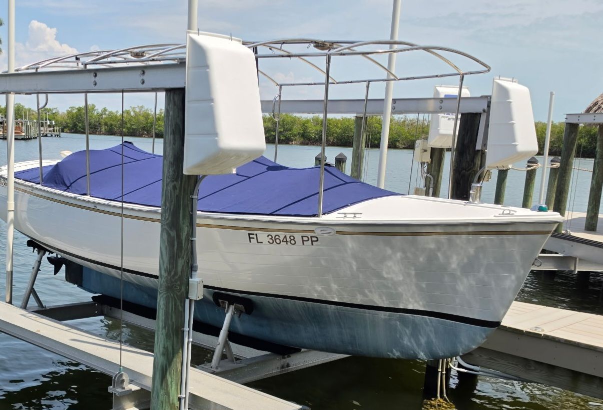 2012 Duffy Snug Harbor 18 boat on a boat lift.