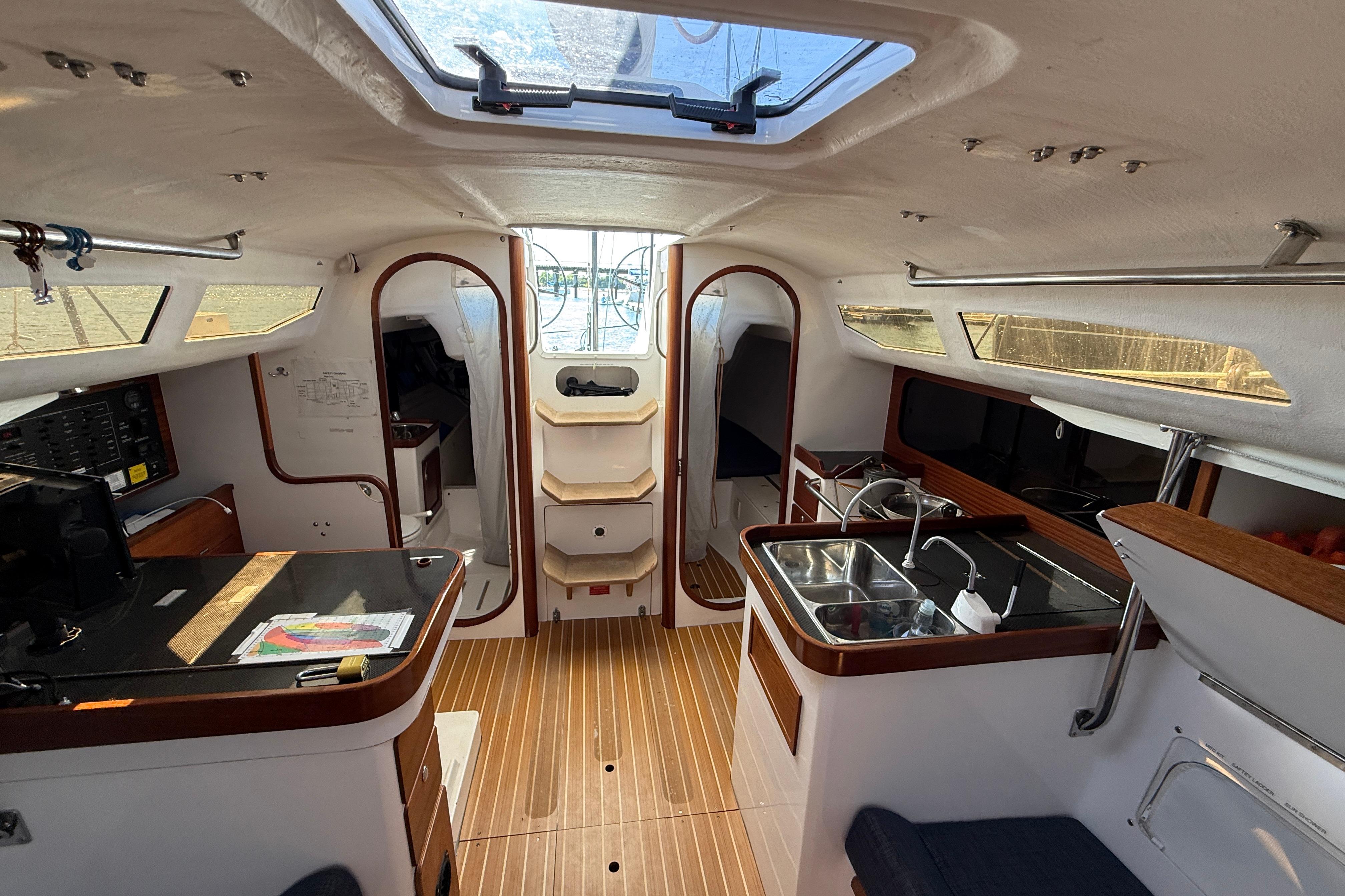 Interior of 2018 J Boats J/121 sailboat, featuring modern kitchen and seating area.