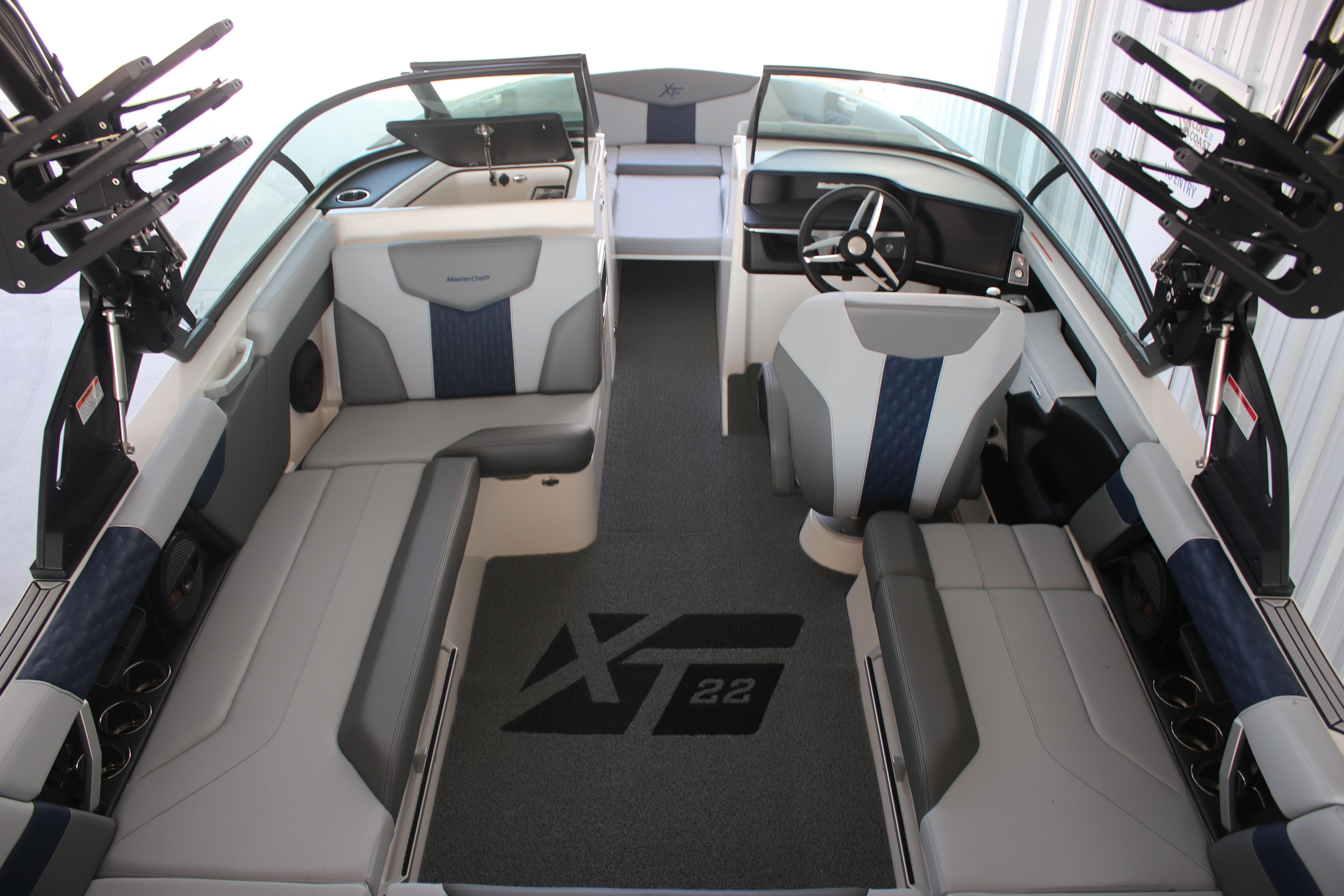 2025 MasterCraft XT22 boat interior with modern seating and steering wheel.
