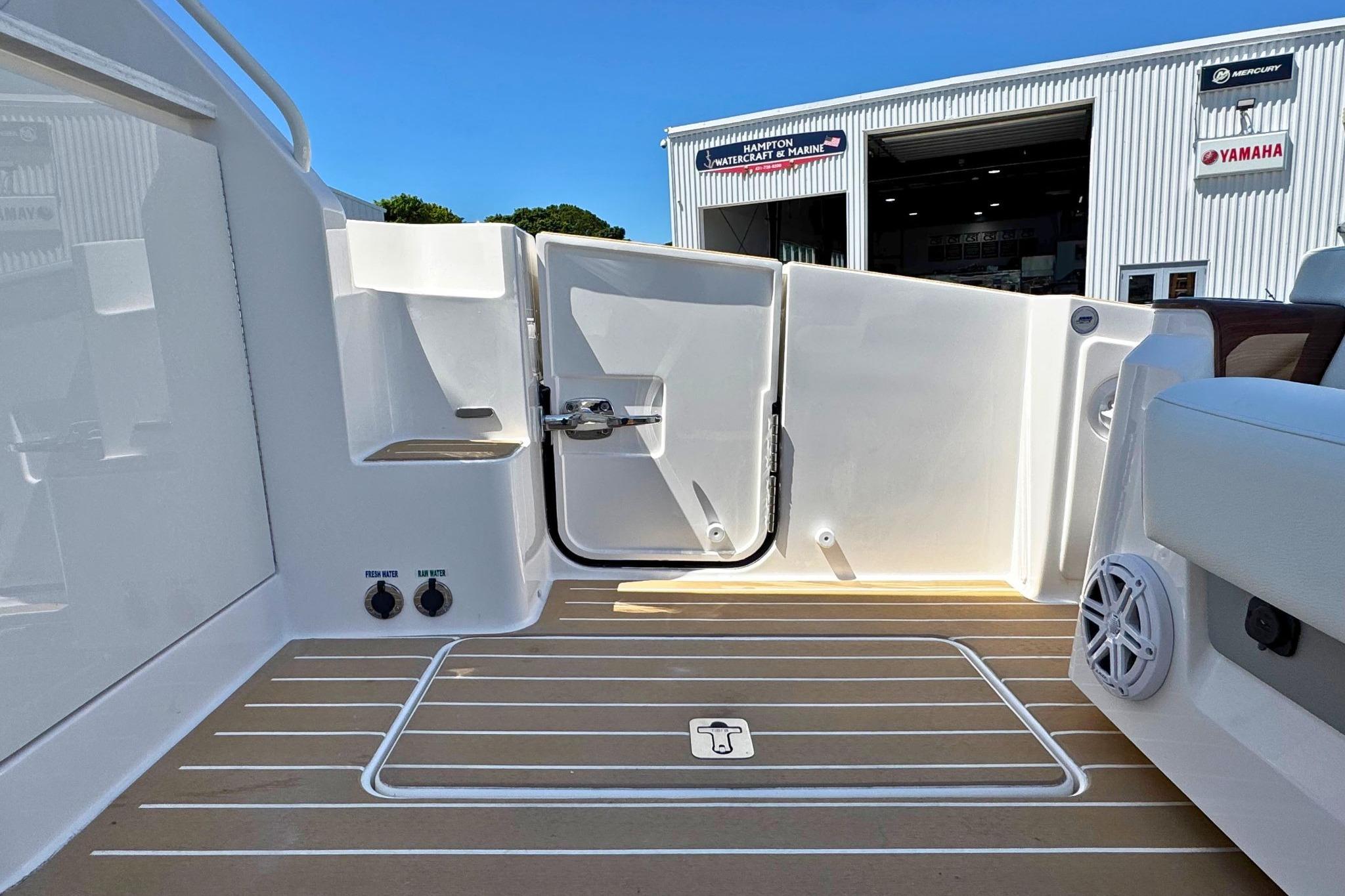 2027 Tiara Yachts 39 LE boat deck with open door, showcasing sleek design and modern features.
