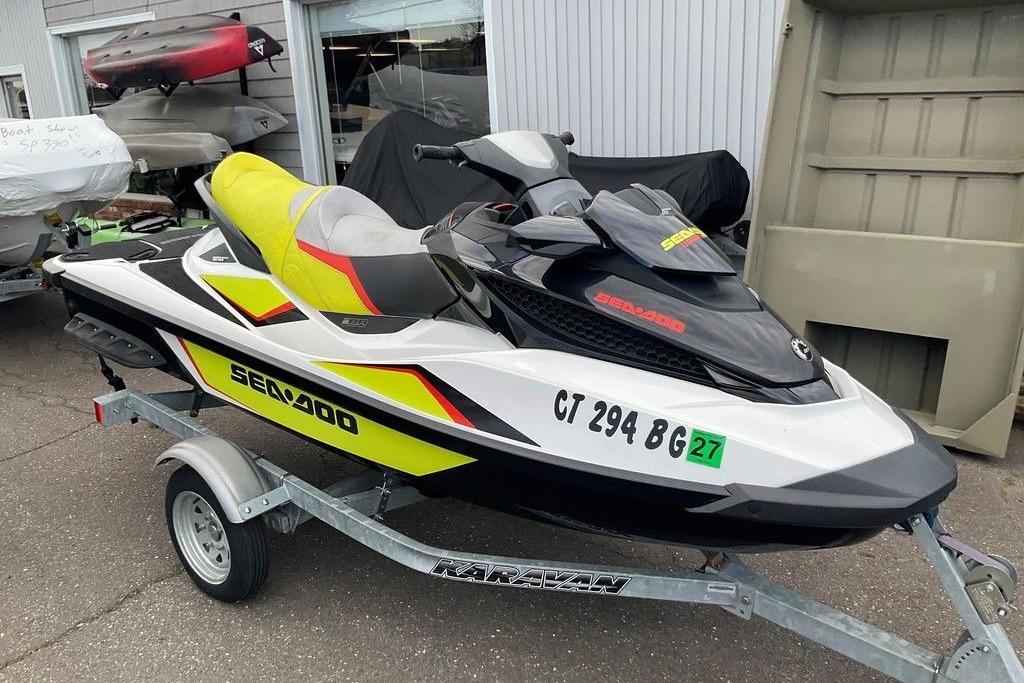 2014 Sea-Doo Wake Pro 215 jet ski on trailer, parked outdoors.