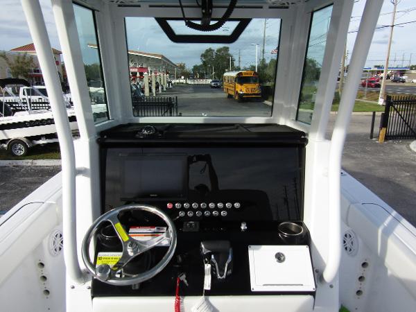 2025 Wellcraft 243 Fisherman boat dashboard with steering wheel and controls.