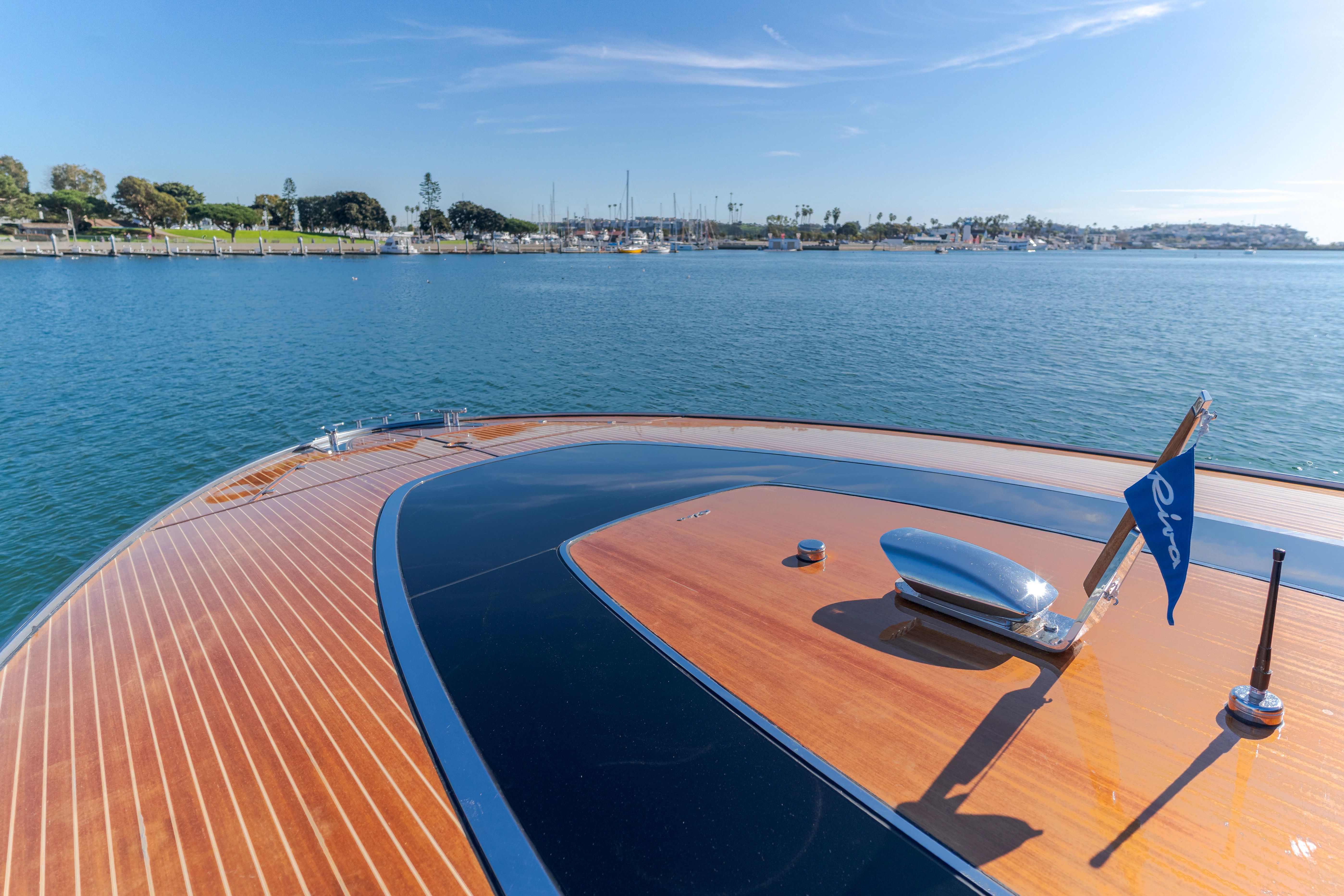 Riva 48' Dolceriva 2021 on calm waters with blue sky.