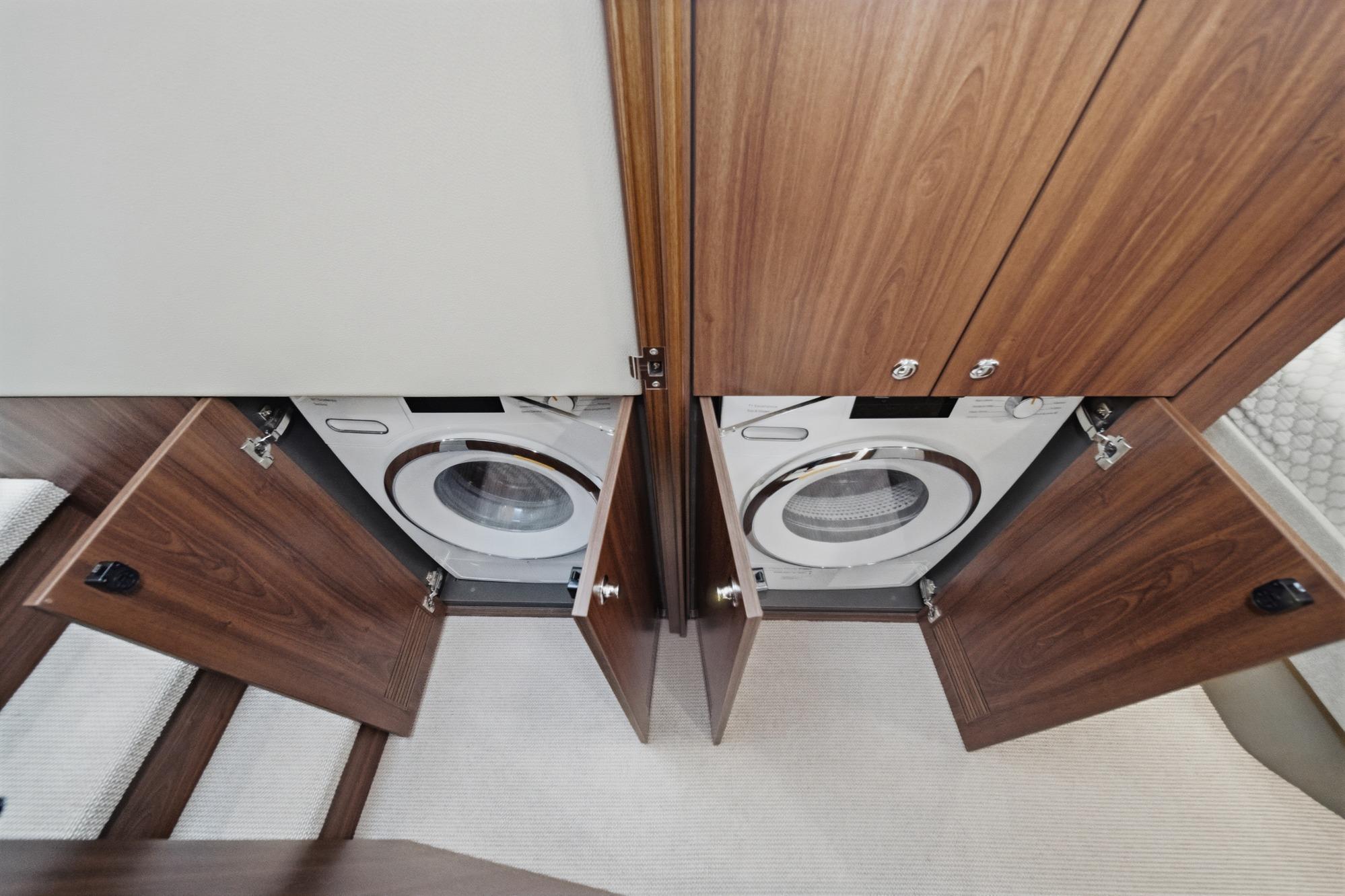 Laundry area with washer and dryer in 2026 Maritimo M55 yacht.