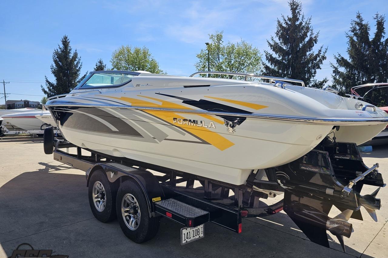 2014 Formula 292 FASTech boat on trailer, featuring sleek design and vibrant graphics.