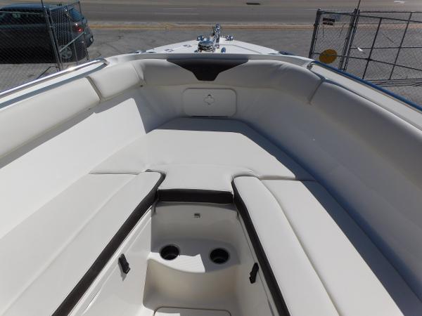 2024 Sailfish 242 CC boat interior with cushioned seating and storage compartments.