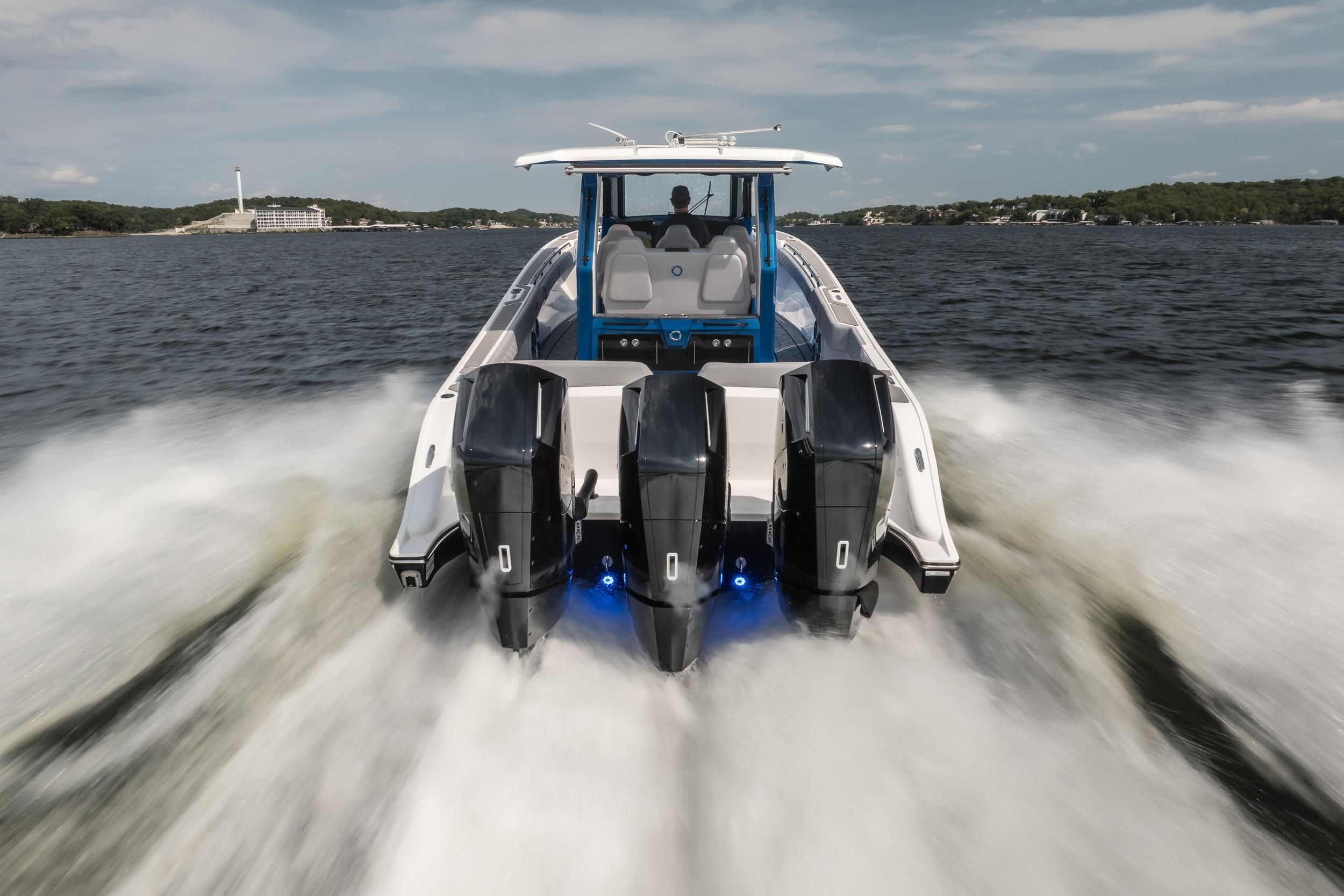 2026 Fountain 43 SCX boat speeding on water with powerful engines.