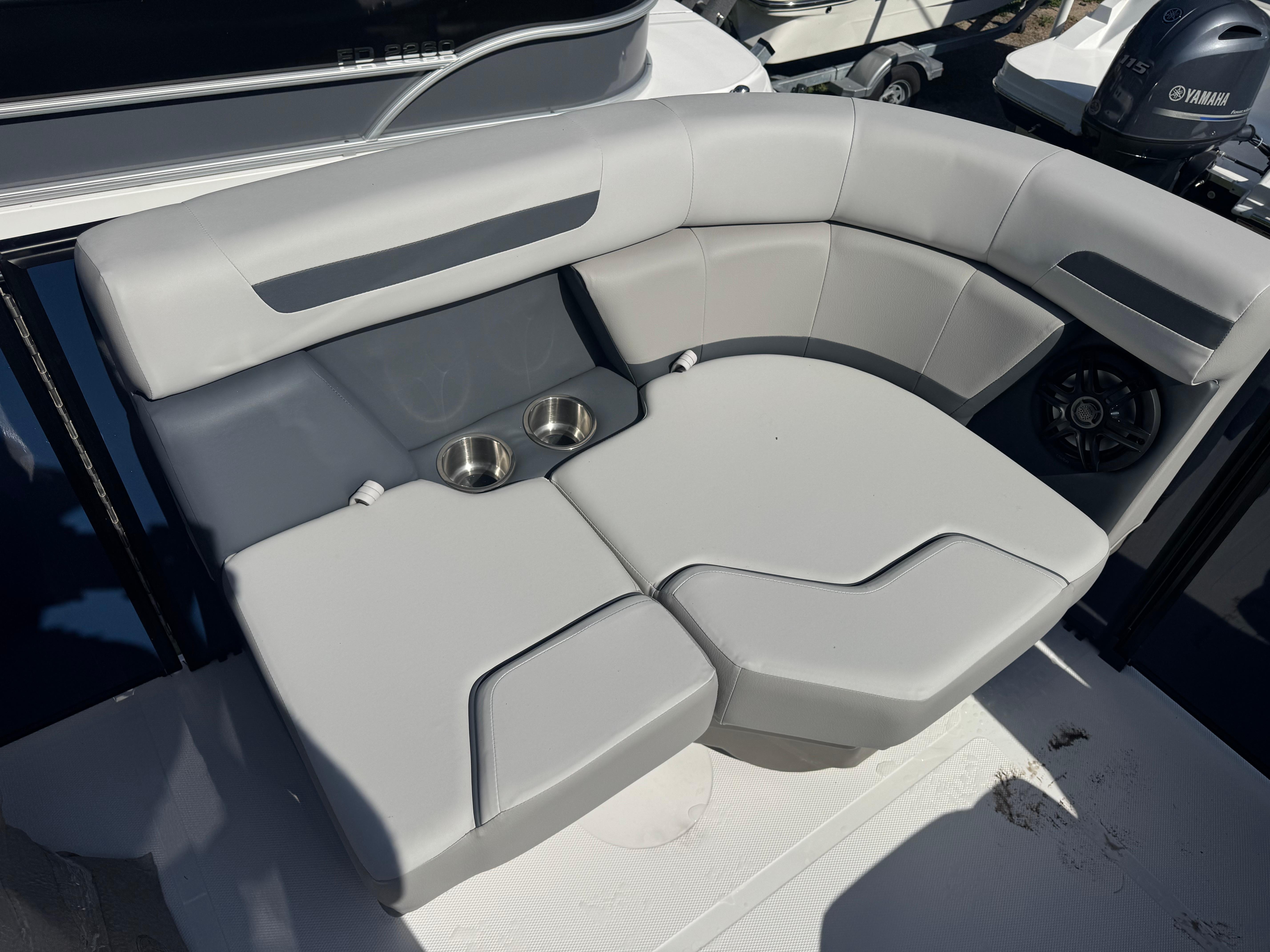 Luxurious seating on 2026 Hurricane FunDeck 1960 RE OB boat with cup holders.